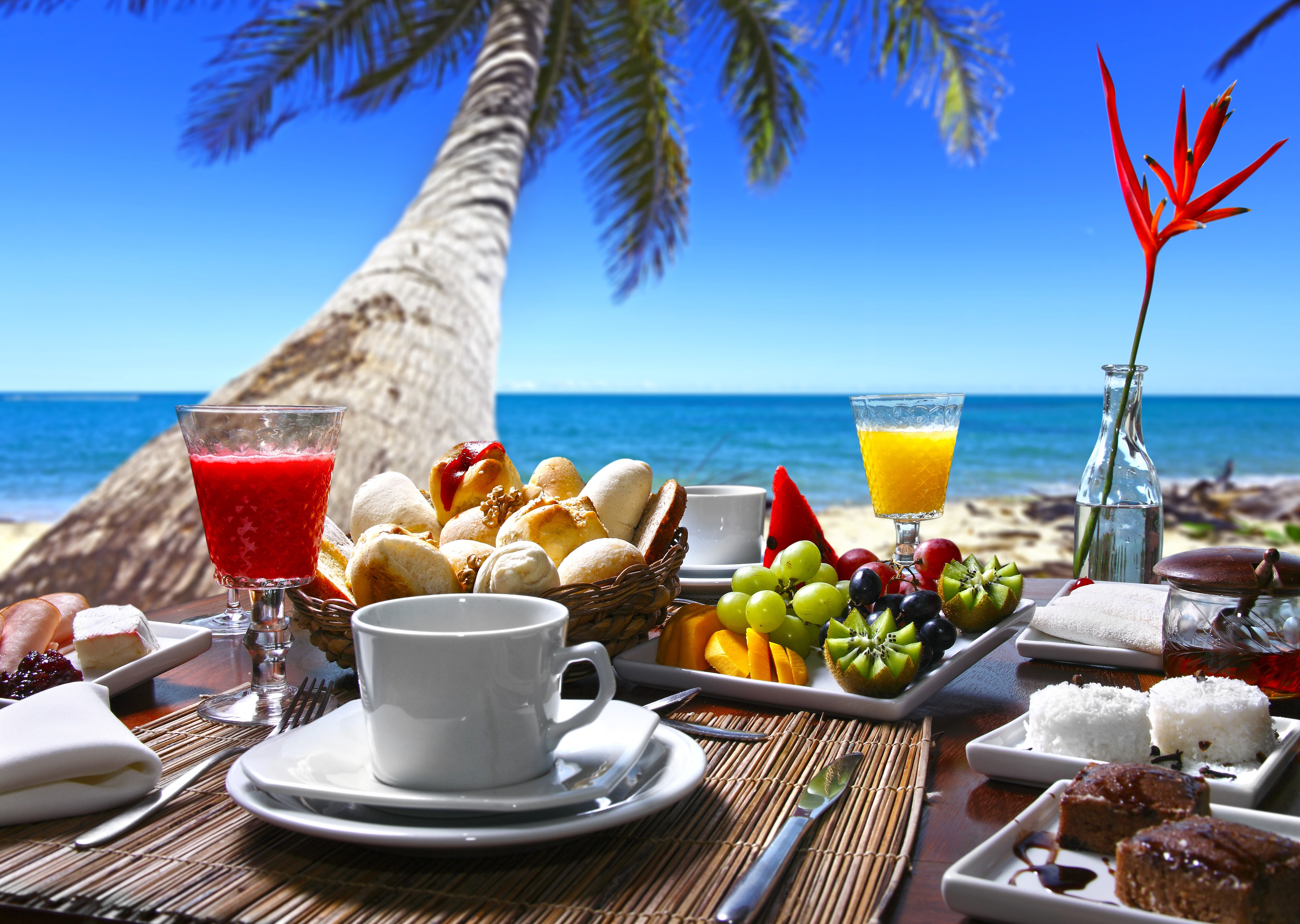 Beach breakfast with fruit and pastries HD Wallpaper
