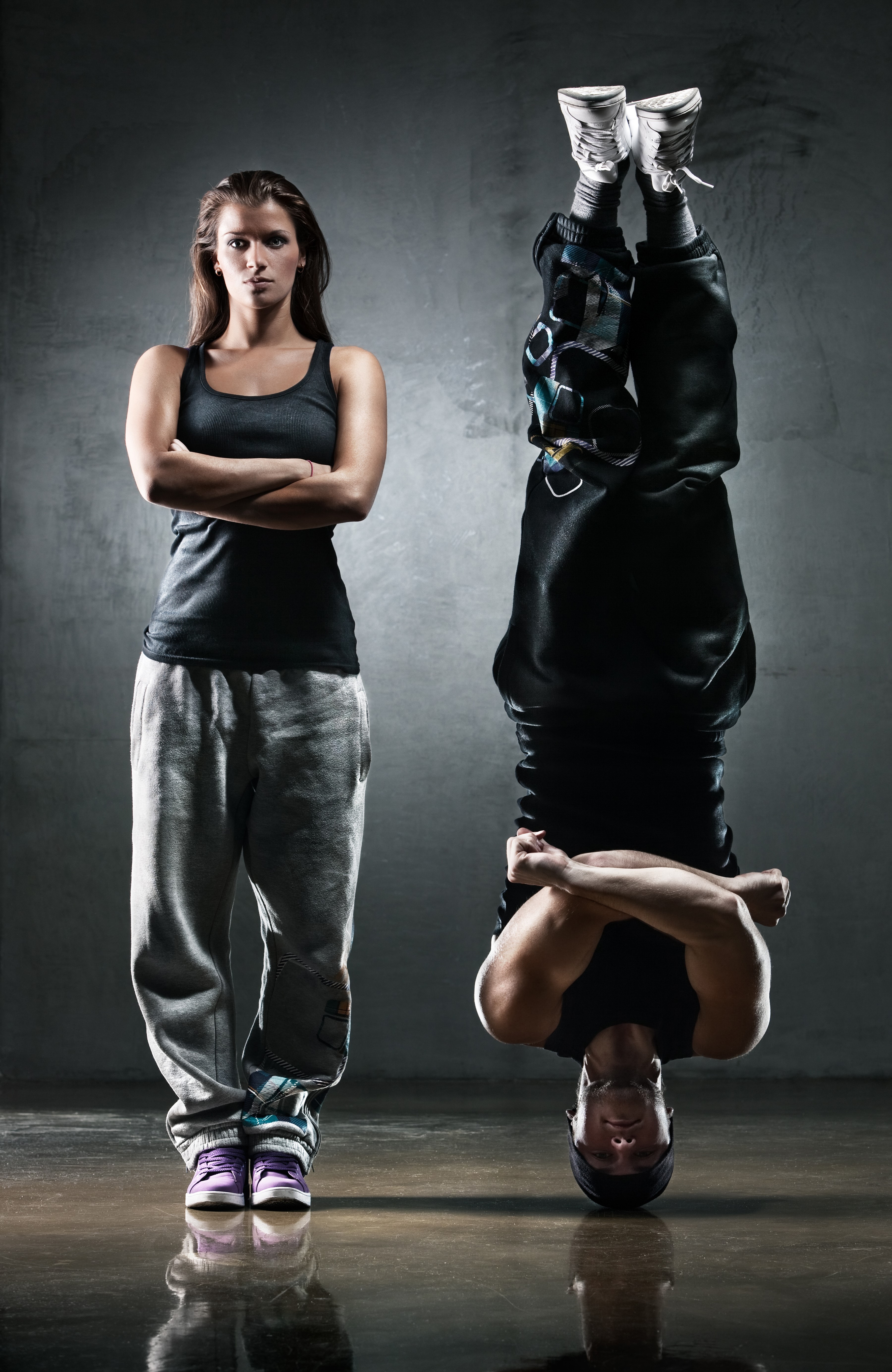 Woman and man breakdancing HD Phone Wallpaper