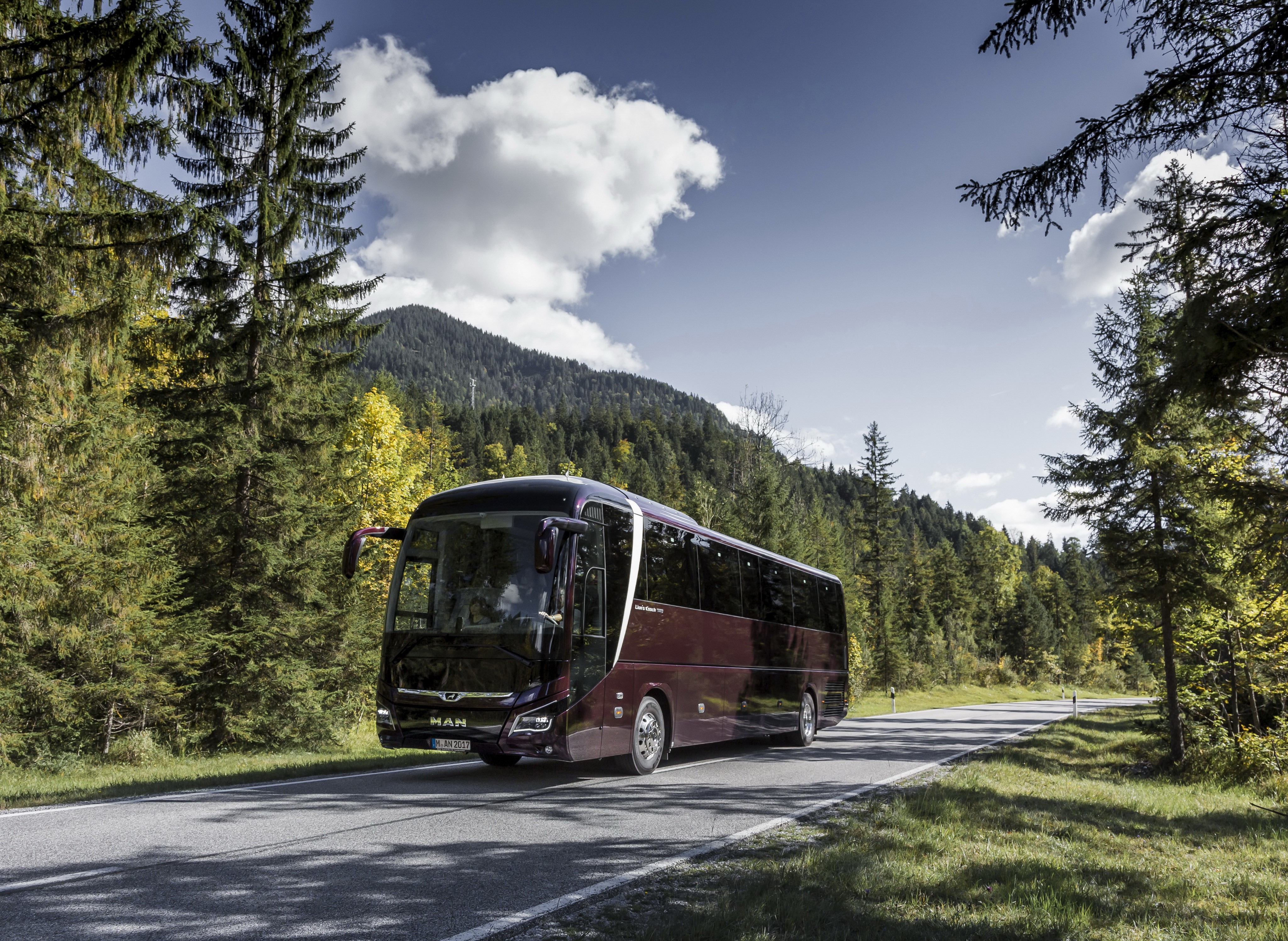 MAN bus on a mountain road HD Wallpaper