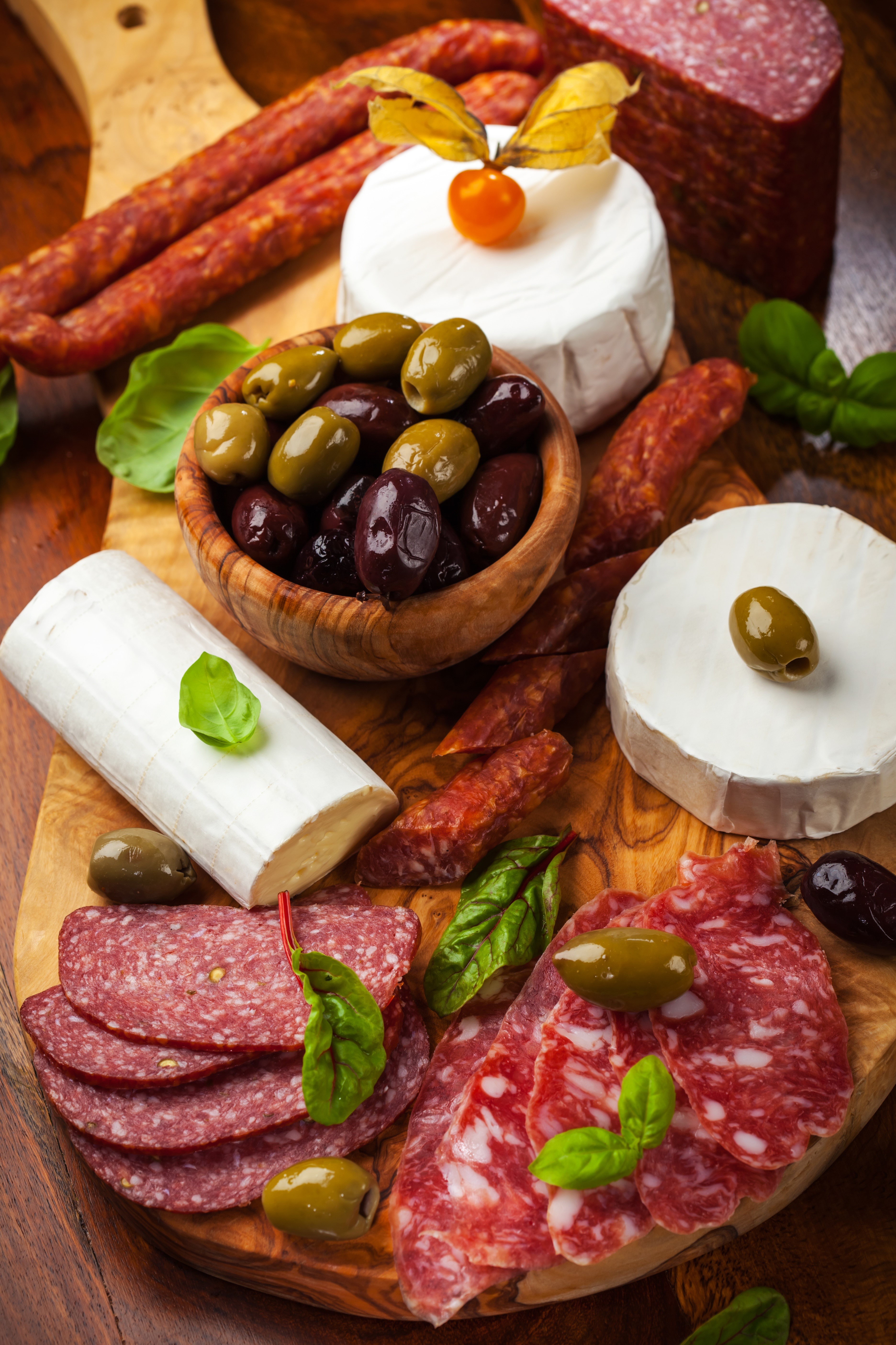 Charcuterie board with salami, cheese, and olives HD Phone Wallpaper