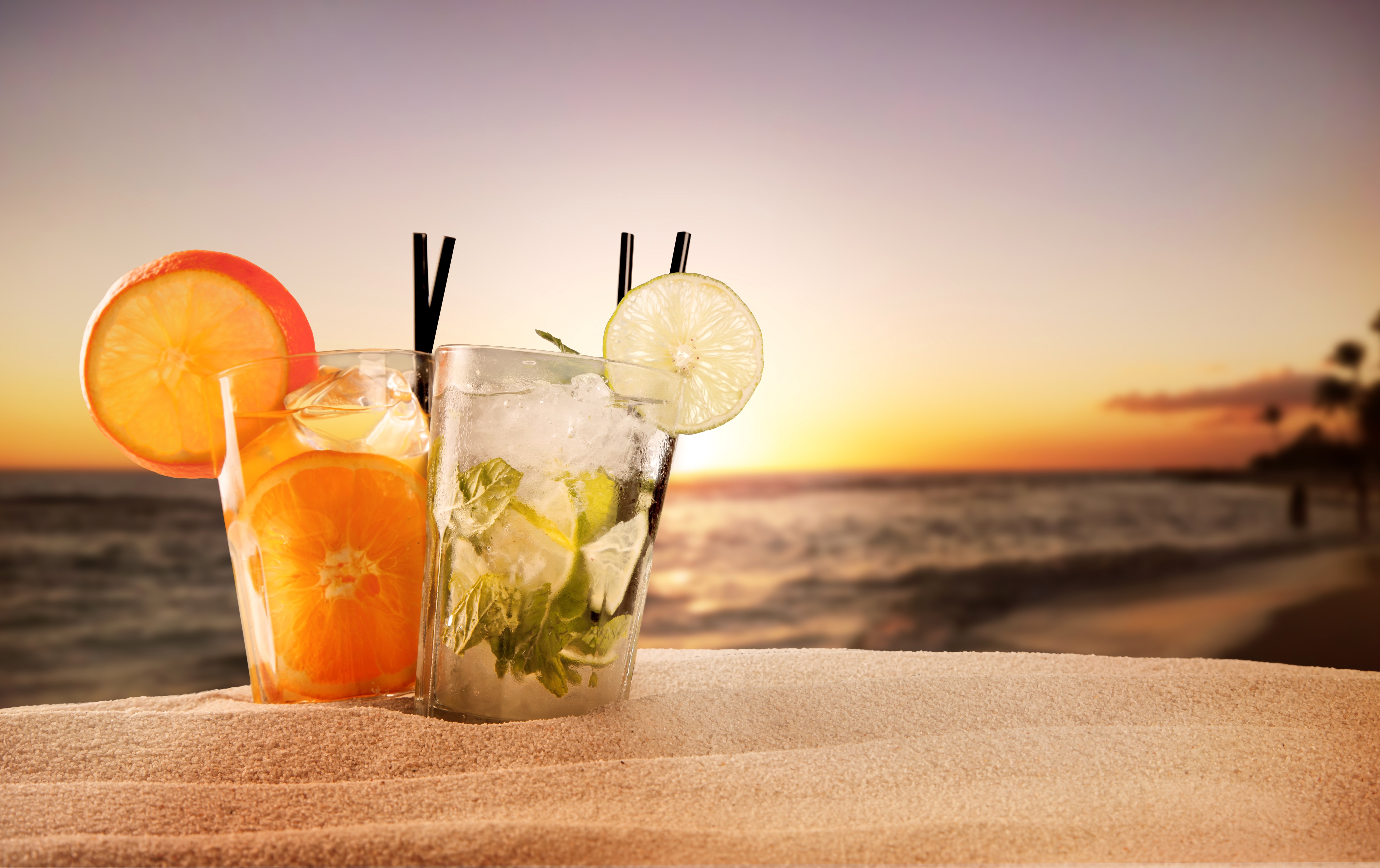 Two cocktails on a beach at sunset HD Wallpaper