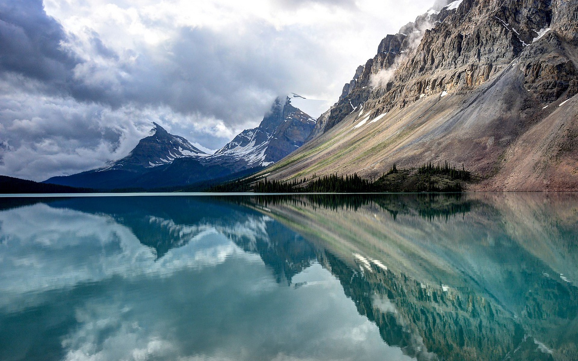 Mountain lake reflection with dramatic clouds HD Wallpaper