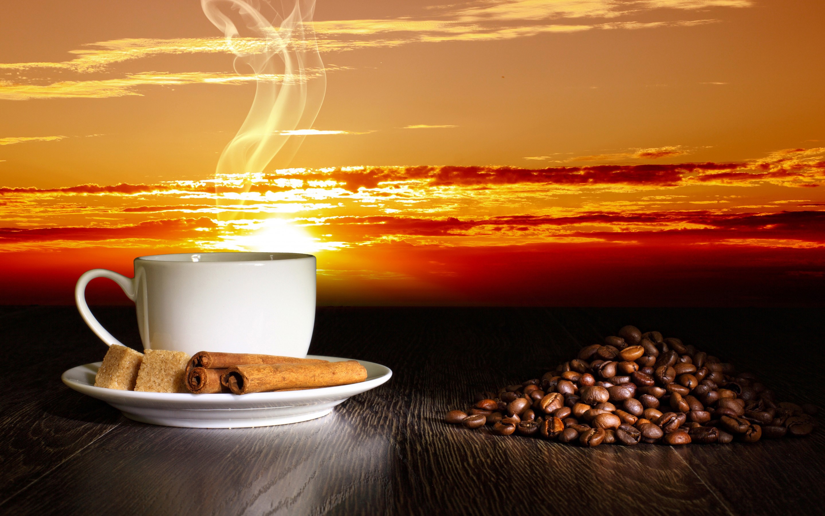 Coffee cup with cinnamon and coffee beans at sunset HD Wallpaper