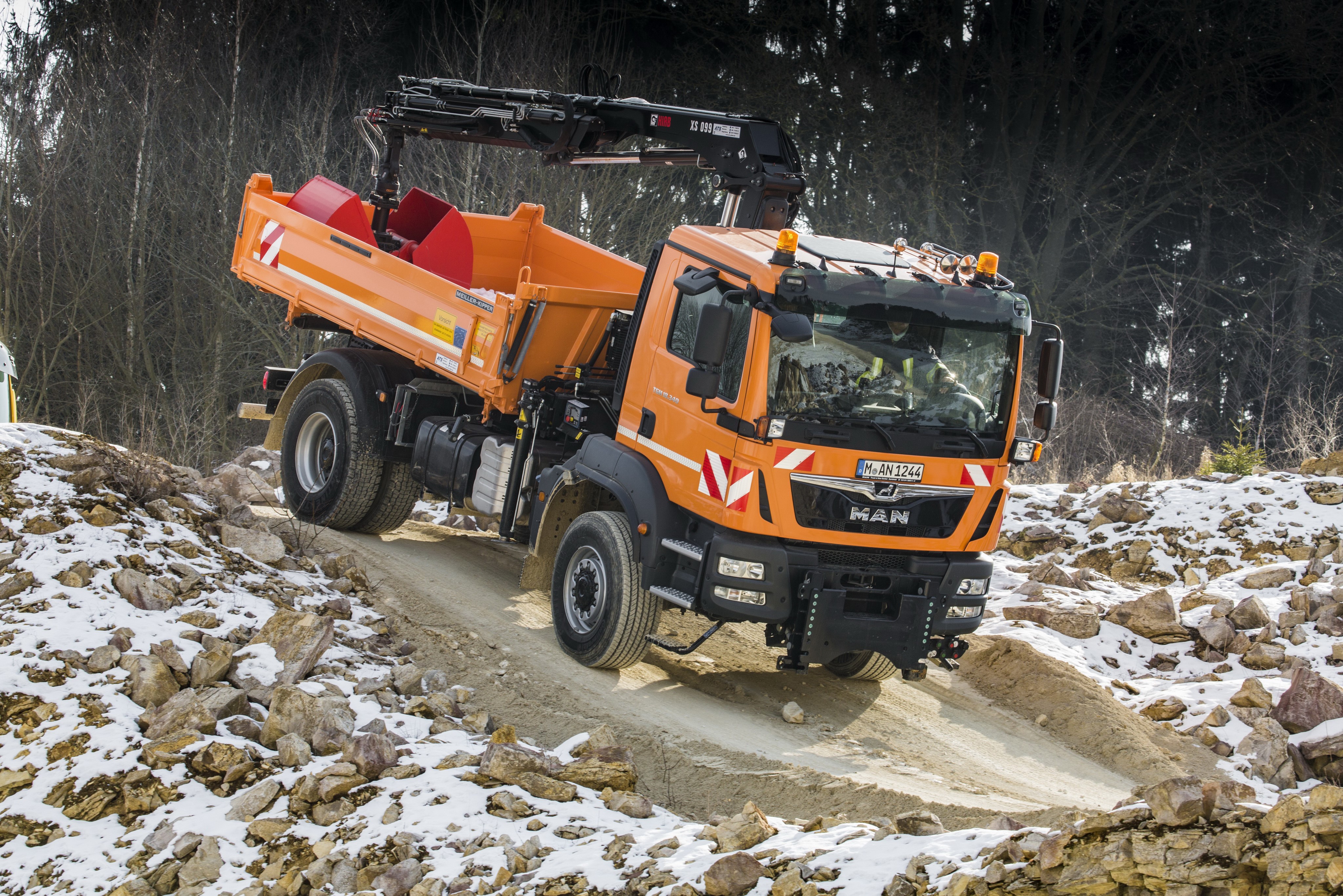 Orange MAN truck with crane on dirt road HD Wallpaper