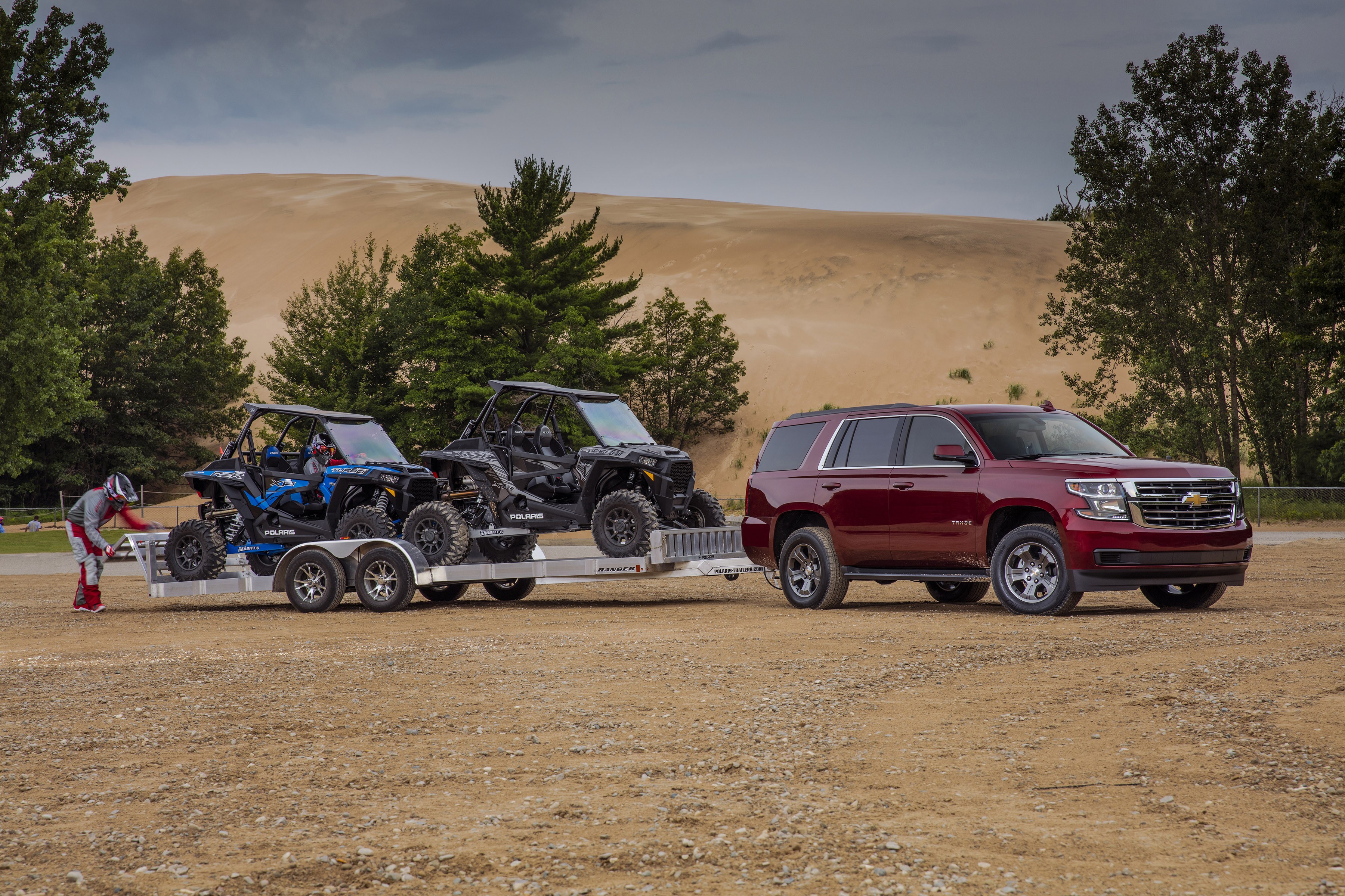 Chevrolet Tahoe towing UTVs on a trailer HD Wallpaper