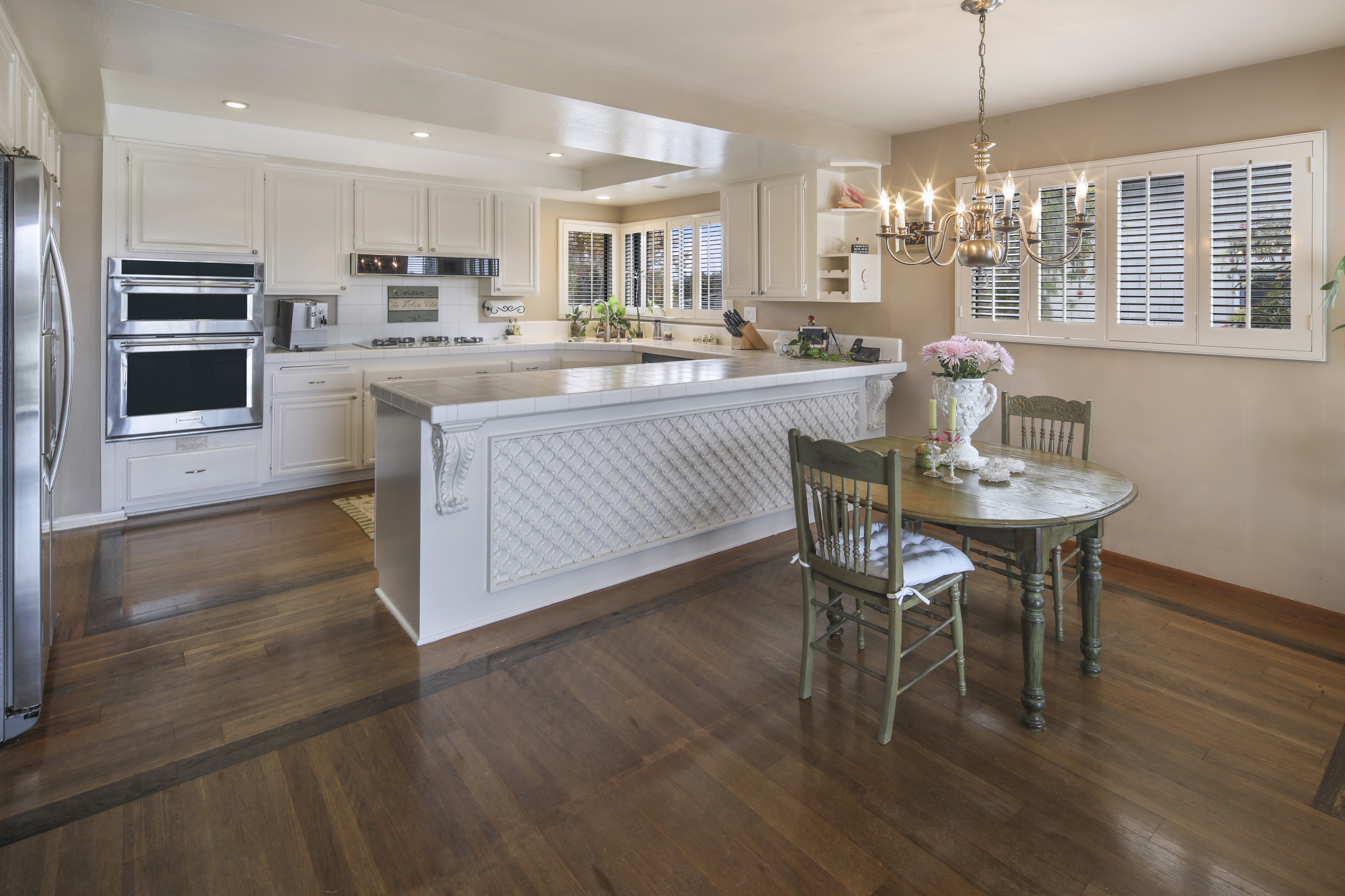 Kitchen with Island, Dining Table, and Chandelier HD Wallpaper