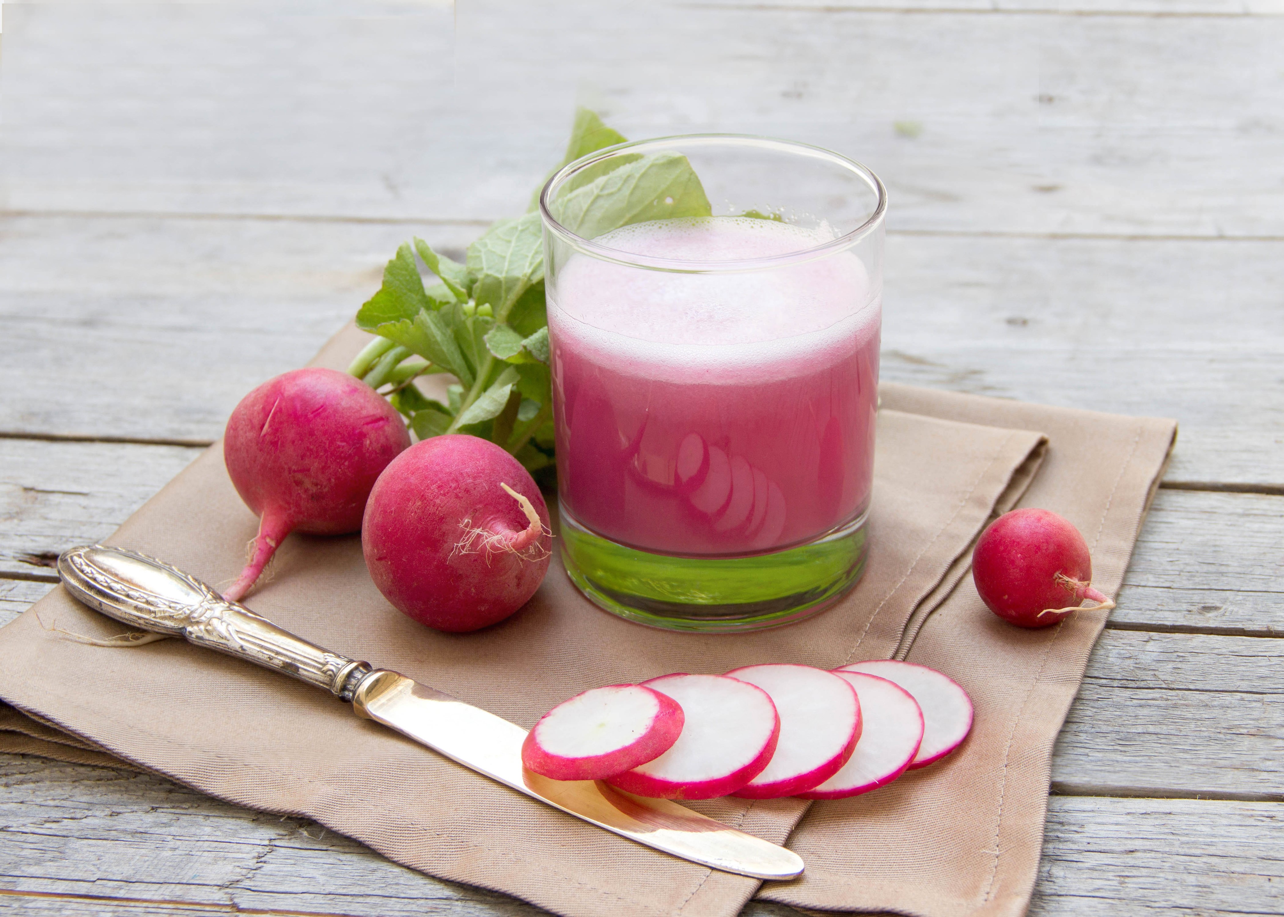 Radish juice with radishes and knife on wood planks HD Wallpaper