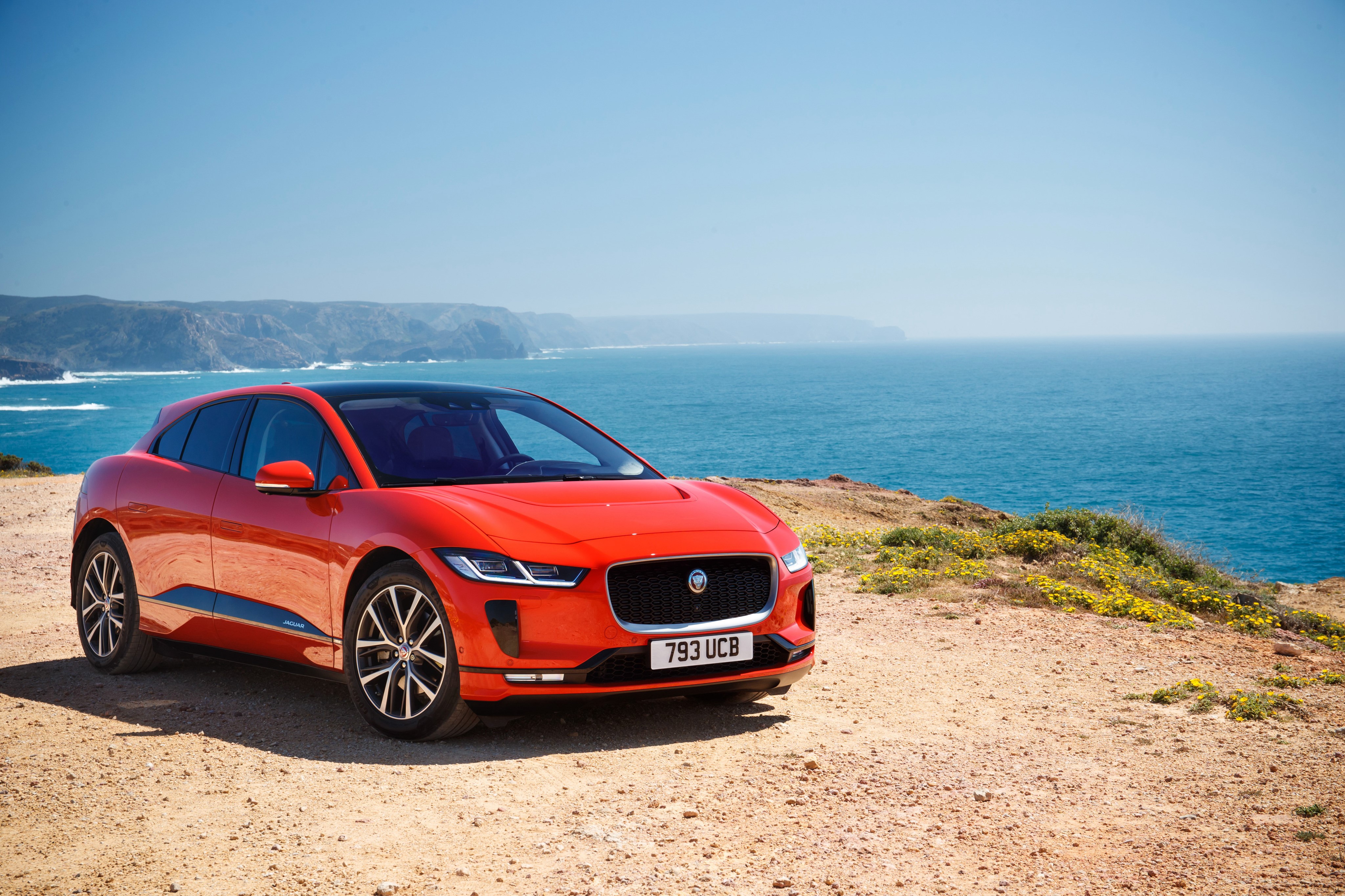 Red Jaguar I-Pace EV400 AWD HSE First Edition by the sea HD Wallpaper