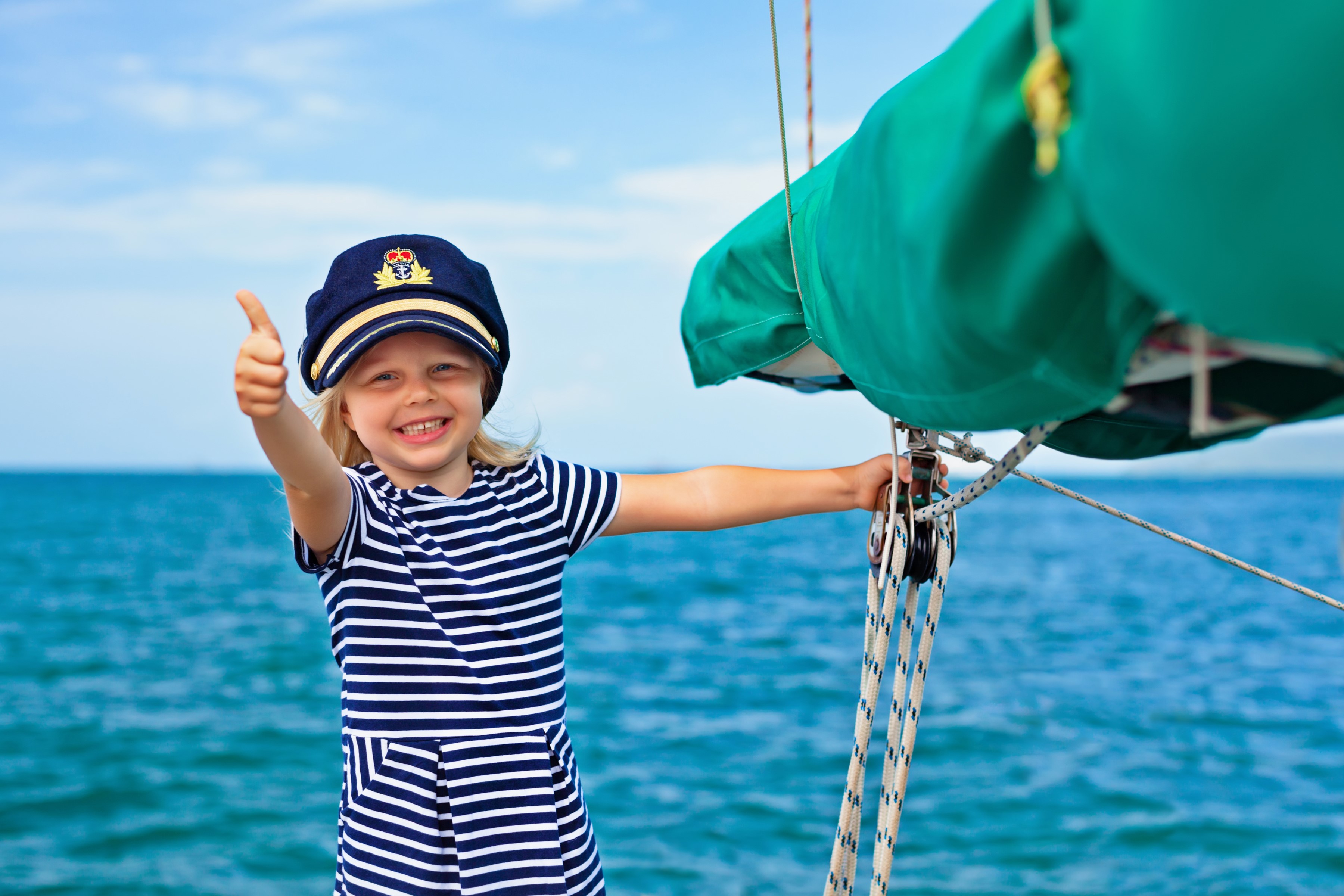 Girl in sailor uniform on a sailboat HD Wallpaper
