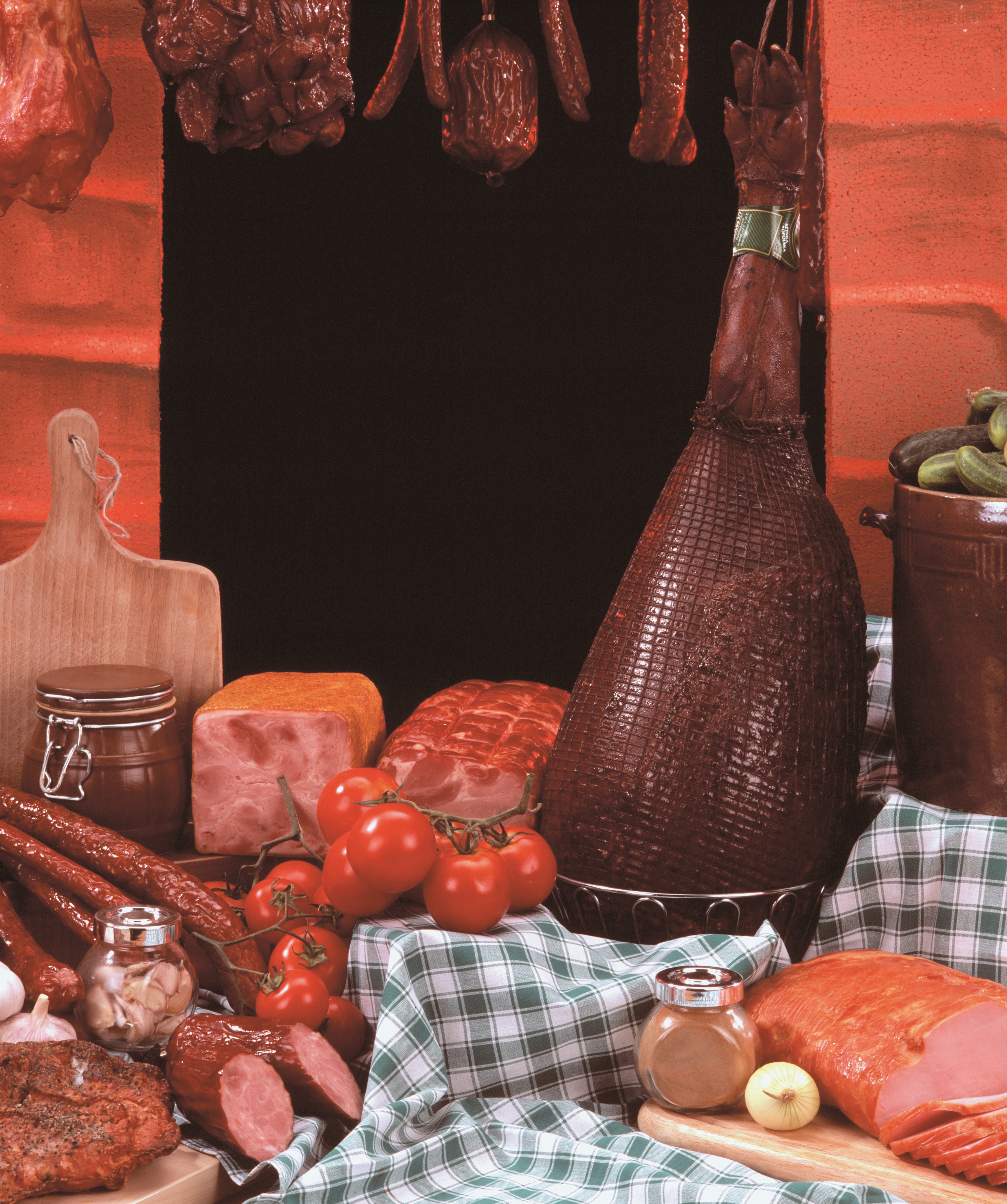 Assortment of cured meats, ham, sausages, and tomatoes HD Wallpaper