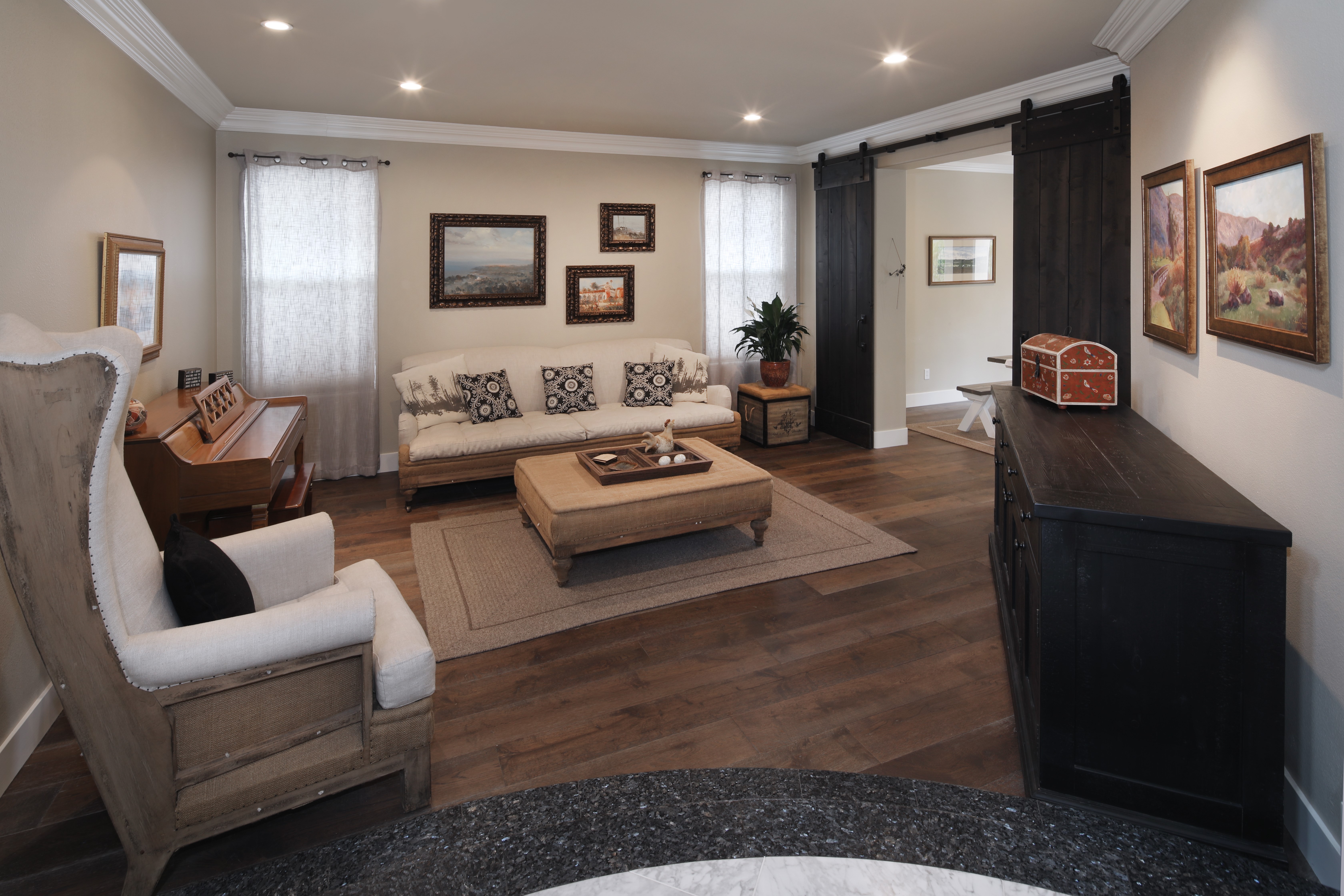 Living room with sofa, armchair, and piano HD Wallpaper
