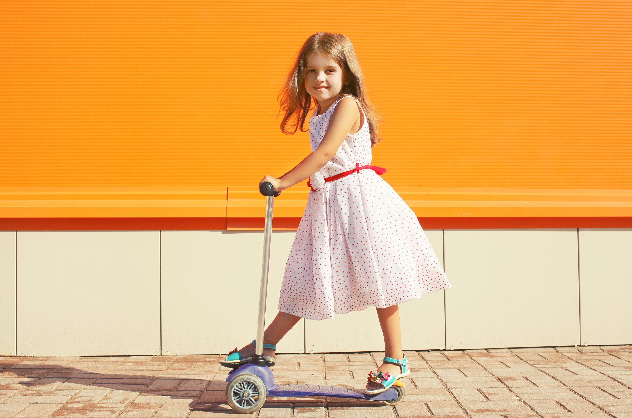 Girl on a scooter HD Wallpaper