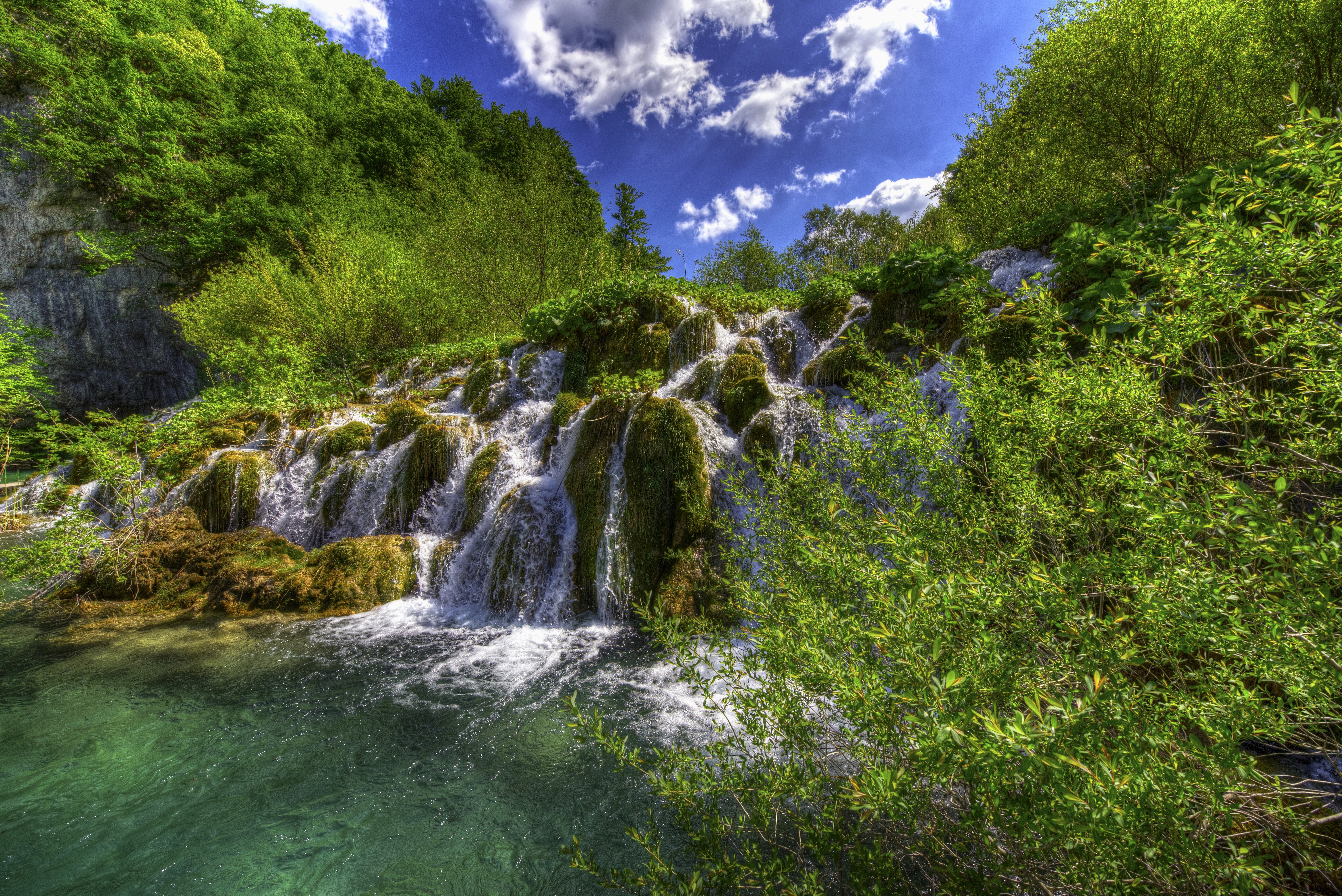 Waterfalls and lush greenery at Plitvice Lakes National Park, Croatia HD Wallpaper