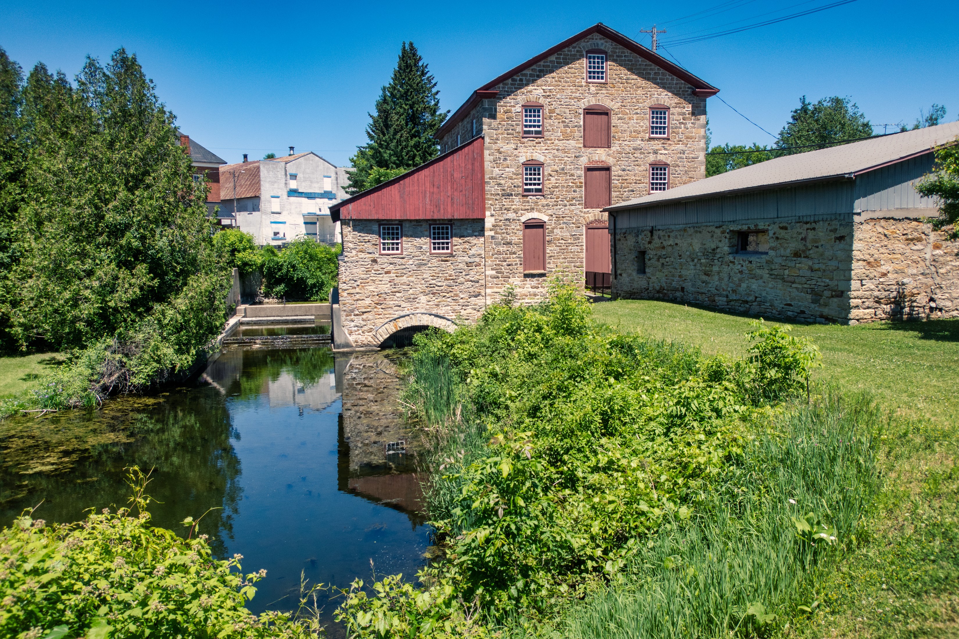 Stone Mill Building by a Pond in Delta, Ontario, Canada HD Wallpaper