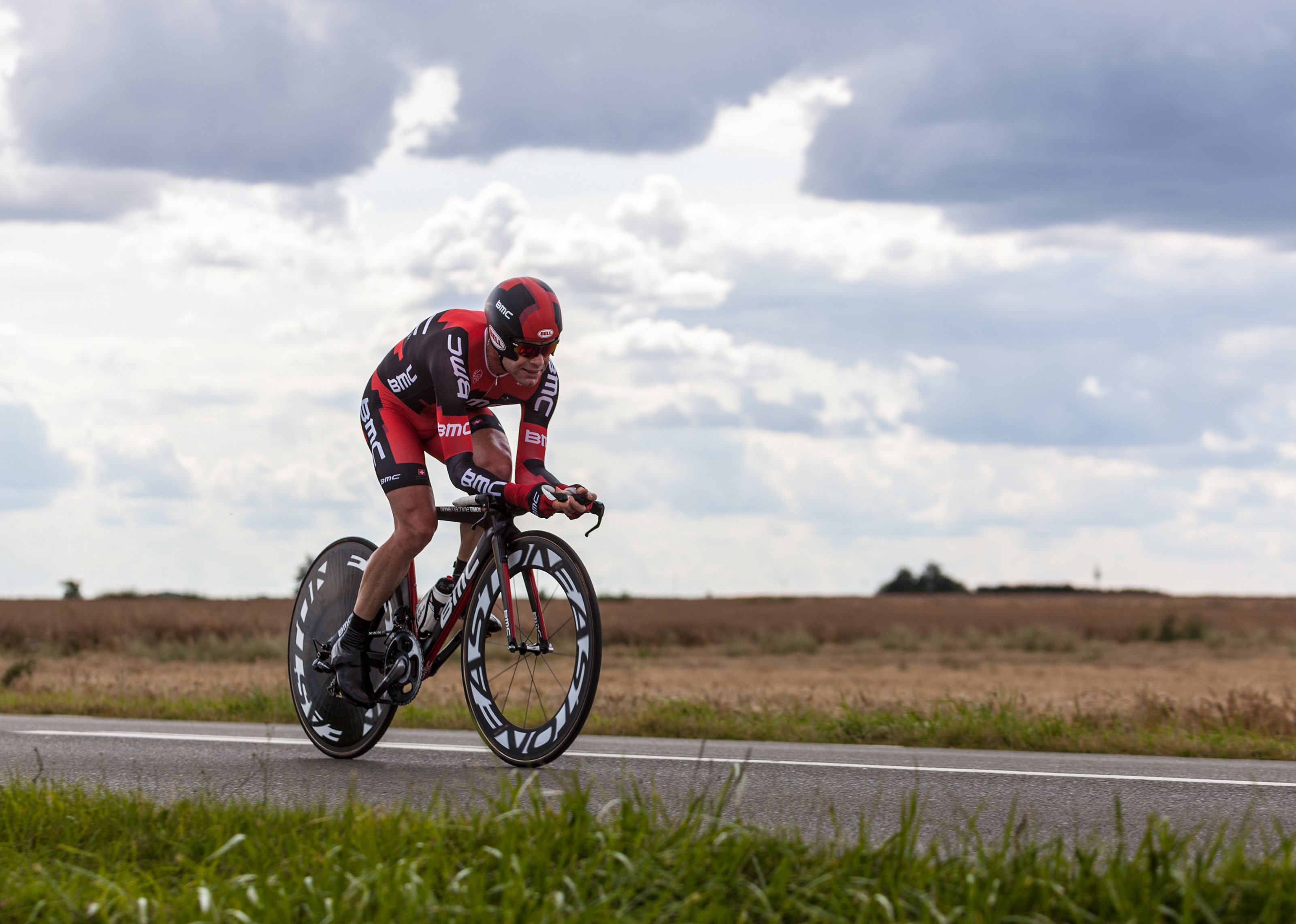 Cyclist in BMC uniform on a road bike HD Wallpaper