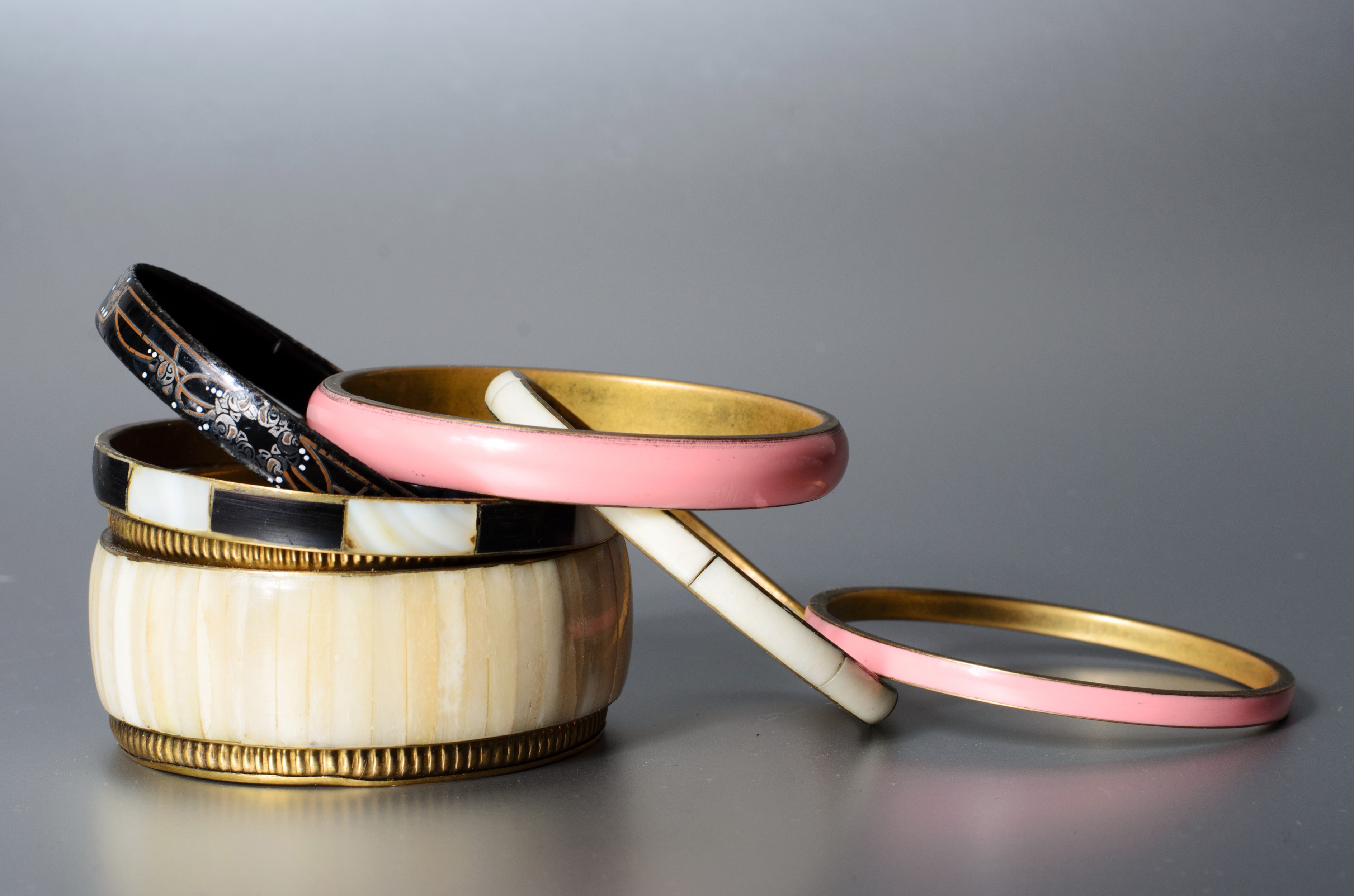 Stack of assorted bangles and bracelets HD Wallpaper