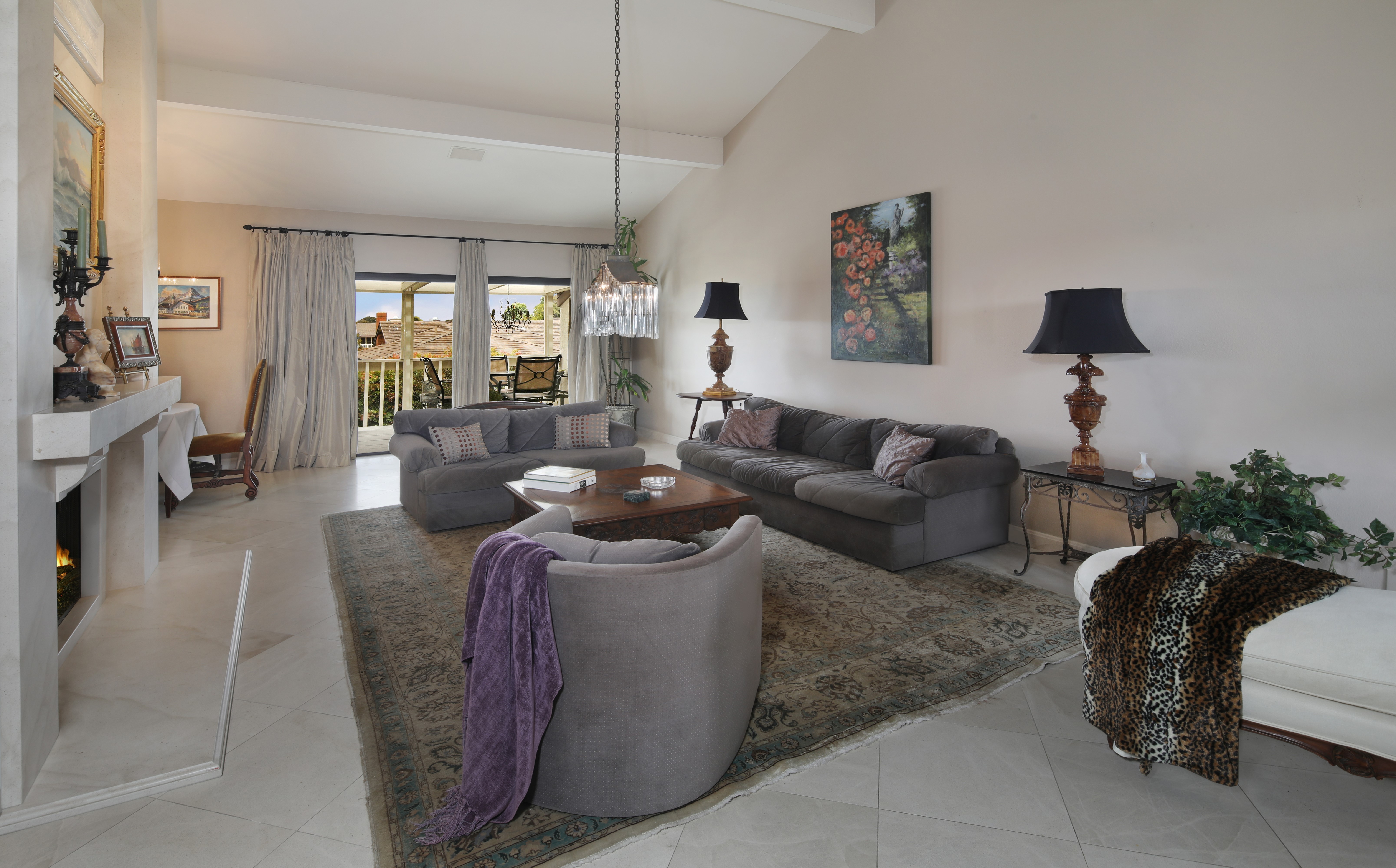 Living room with sofas, carpet, and chandelier HD Wallpaper