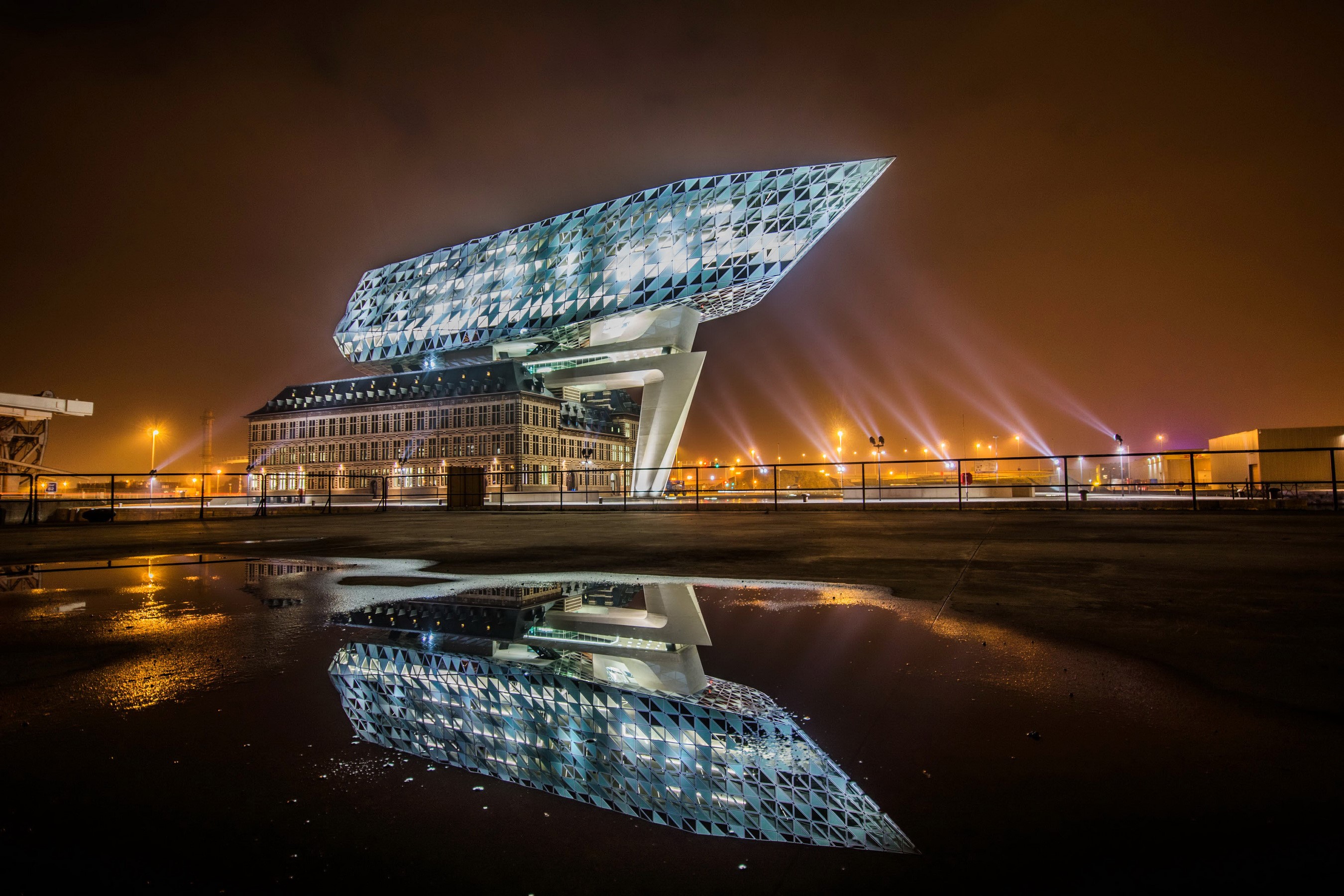 Port House building in Antwerp, Belgium at night with reflection HD Wallpaper