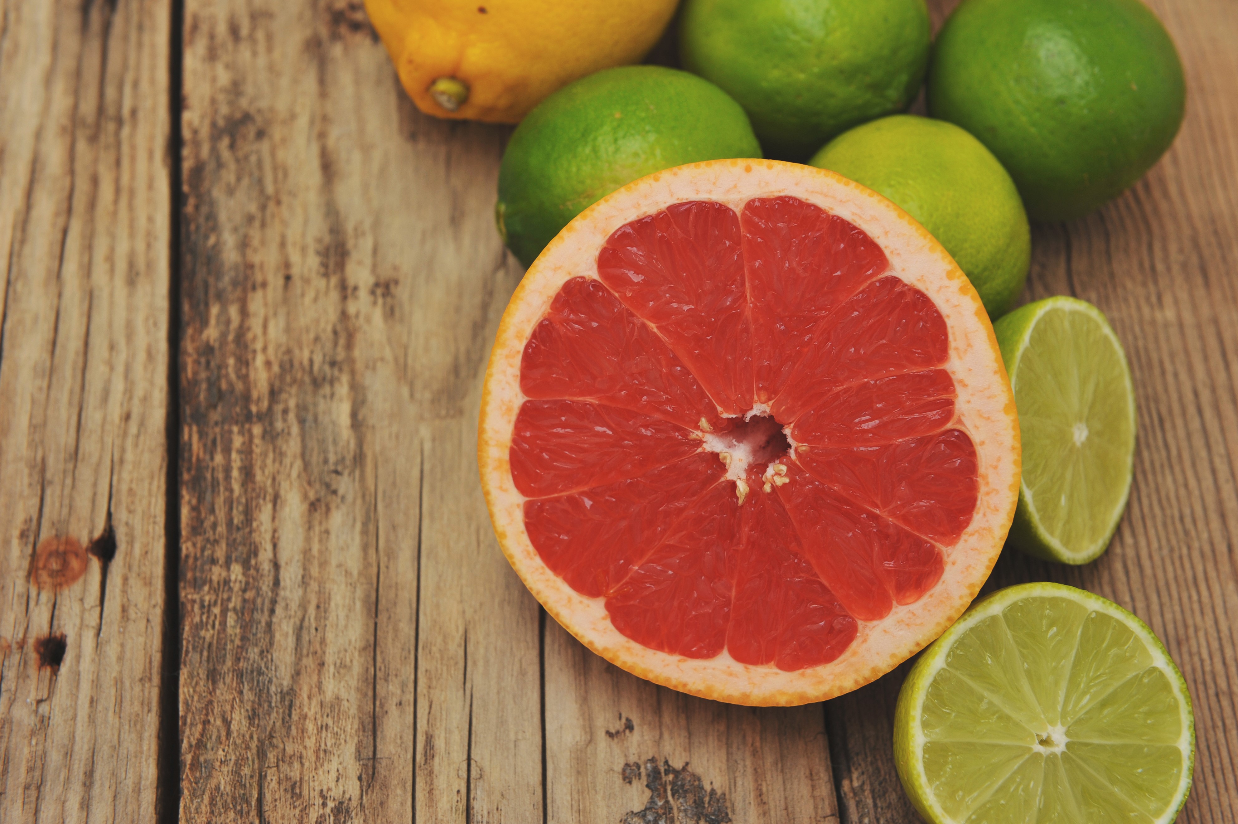 Grapefruit, Limes, and Lemon on Wood Planks HD Wallpaper