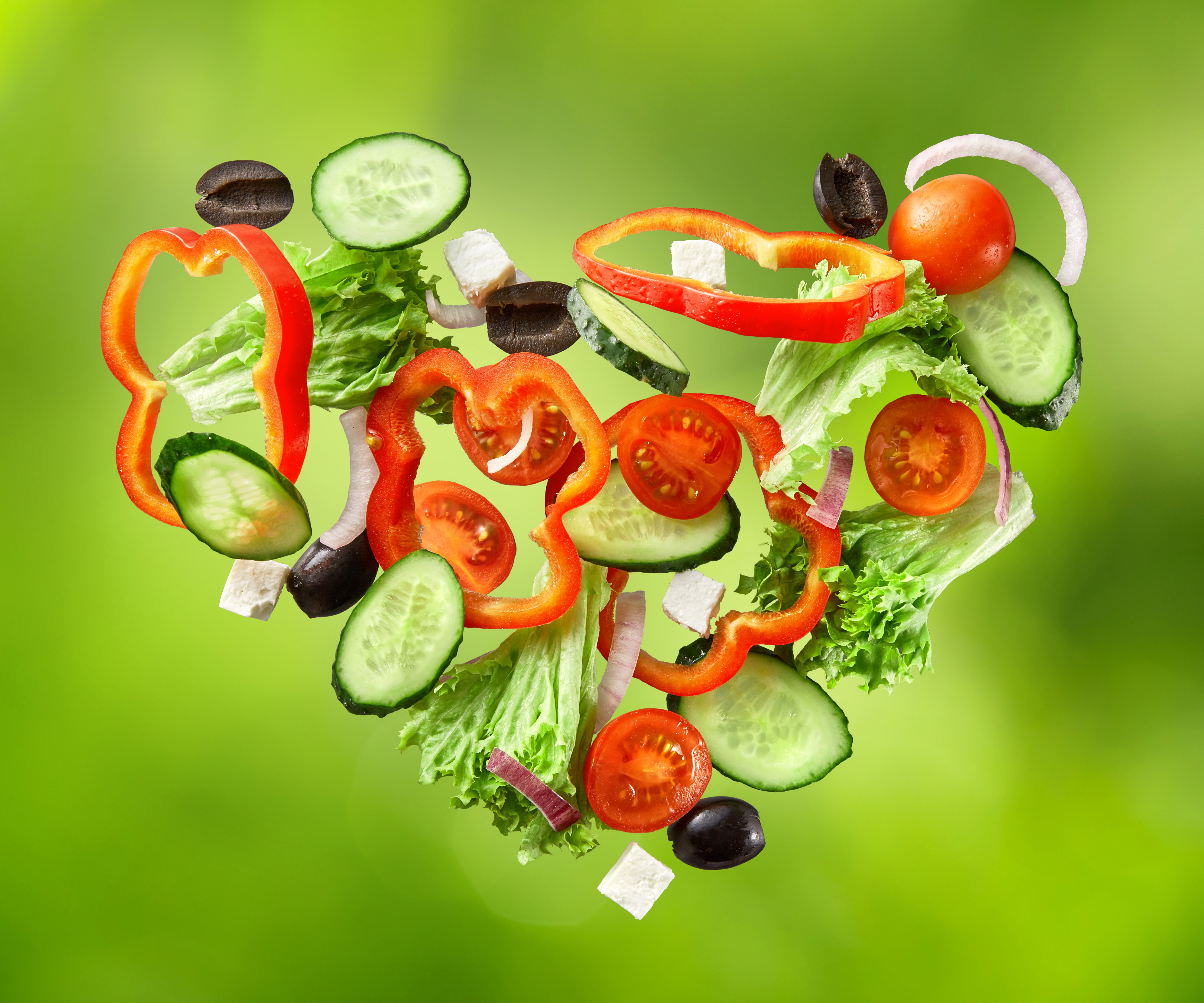 Heart shape salad with vegetables and olives HD Wallpaper