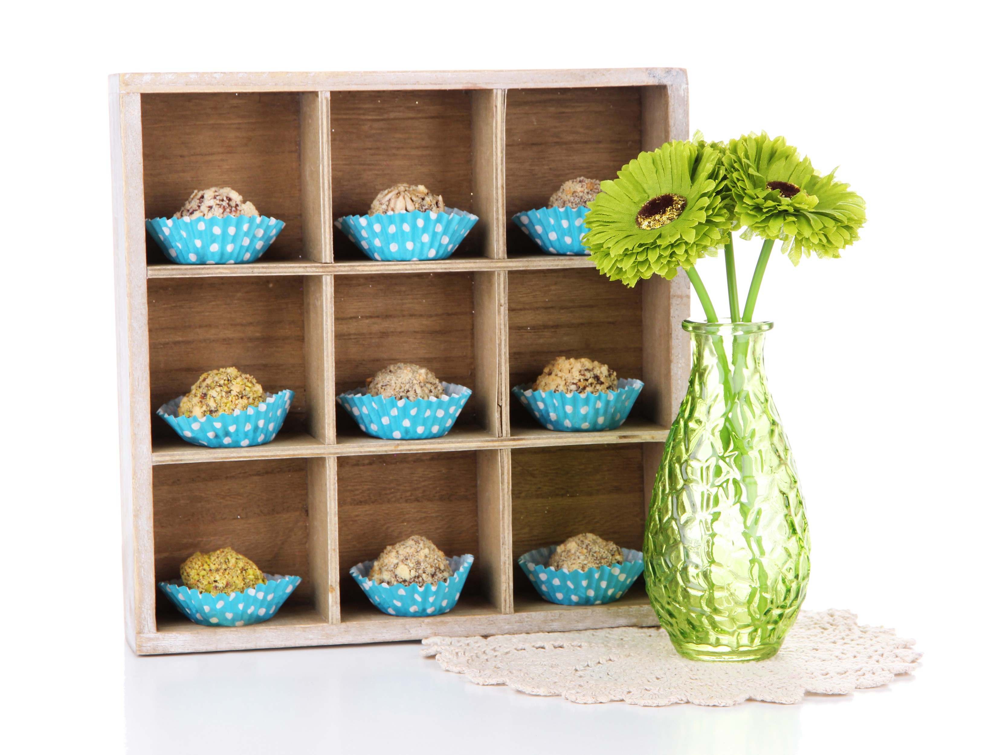 Sweets in a wooden organizer with green gerberas in a vase HD Wallpaper