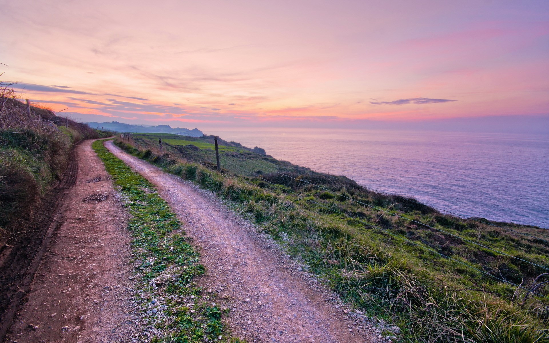 Coastal path at sunset overlooking the ocean HD Wallpaper