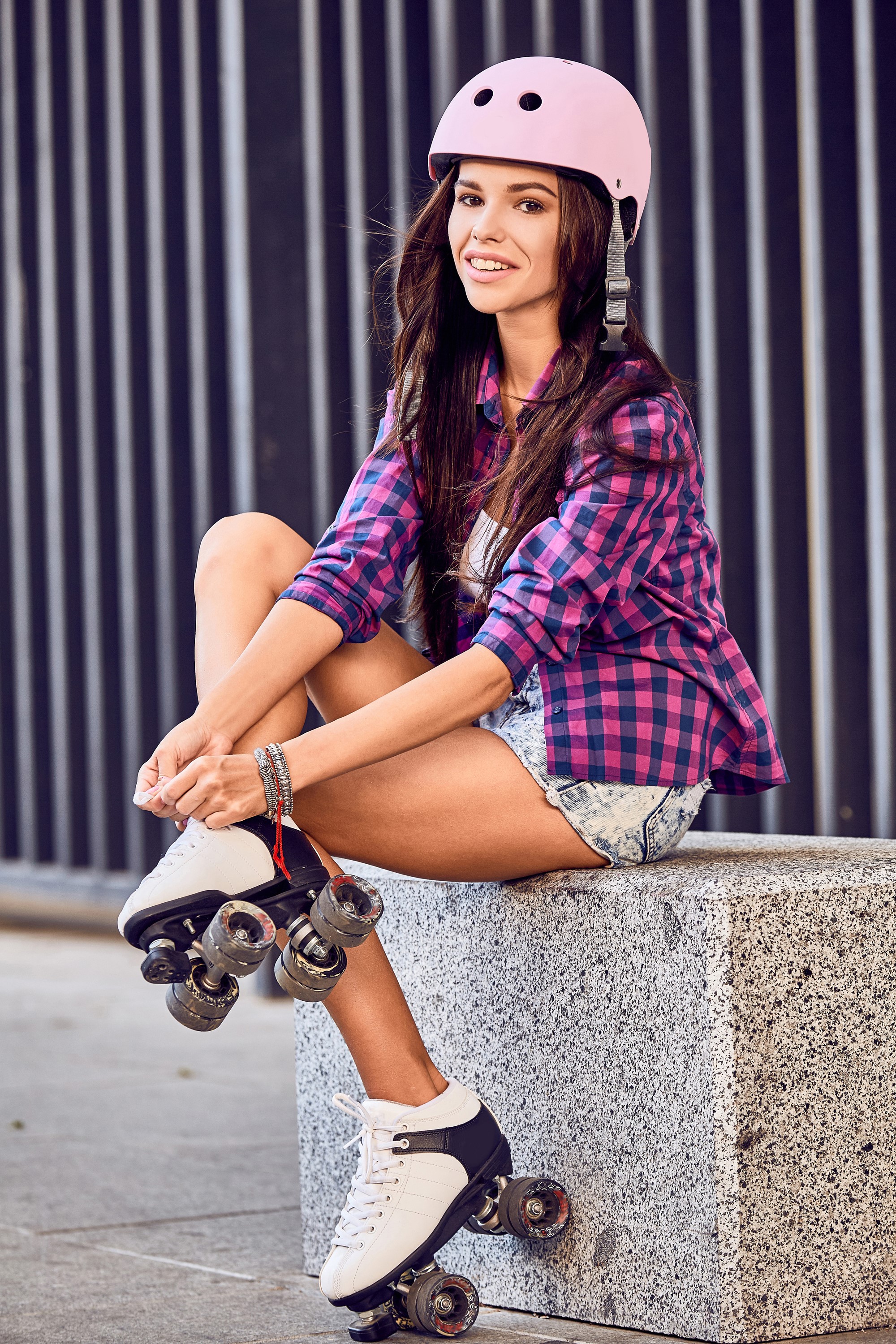 Woman with roller skates and helmet smiling HD Phone Wallpaper