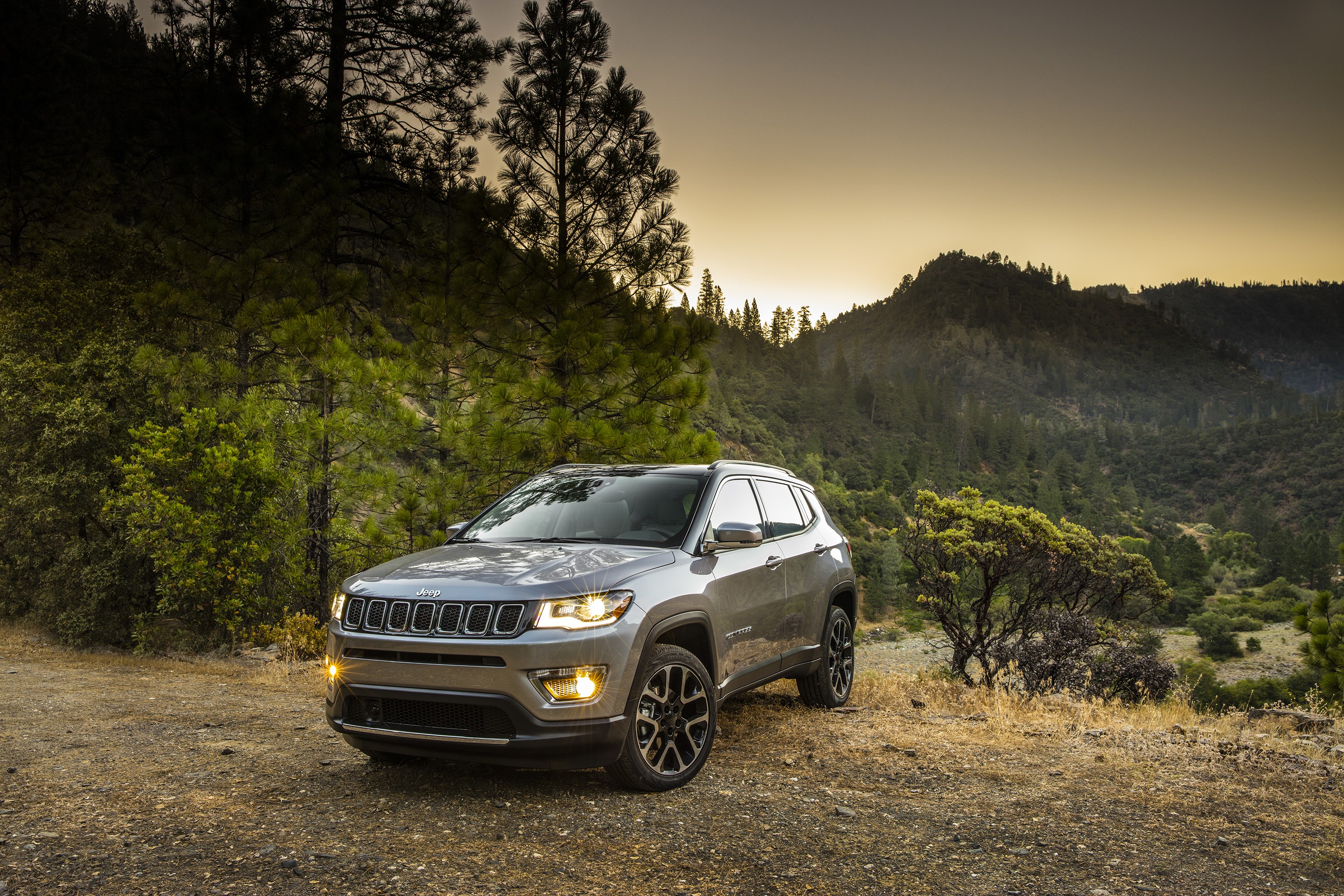 Grey Jeep Compass Trailhawk SUV on a mountain road HD Wallpaper