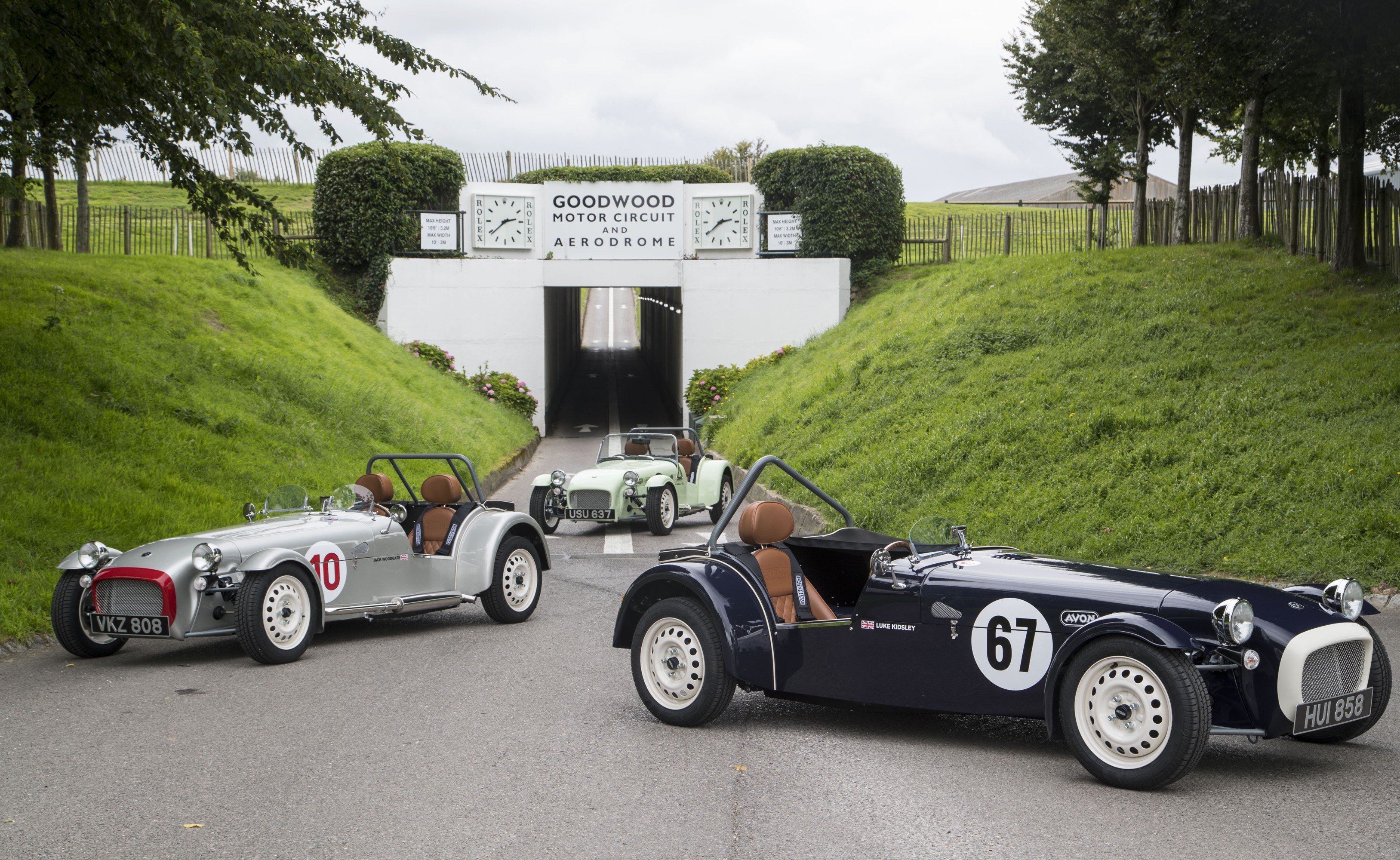 Three Caterham 7 cars at Goodwood Motor Circuit HD Wallpaper