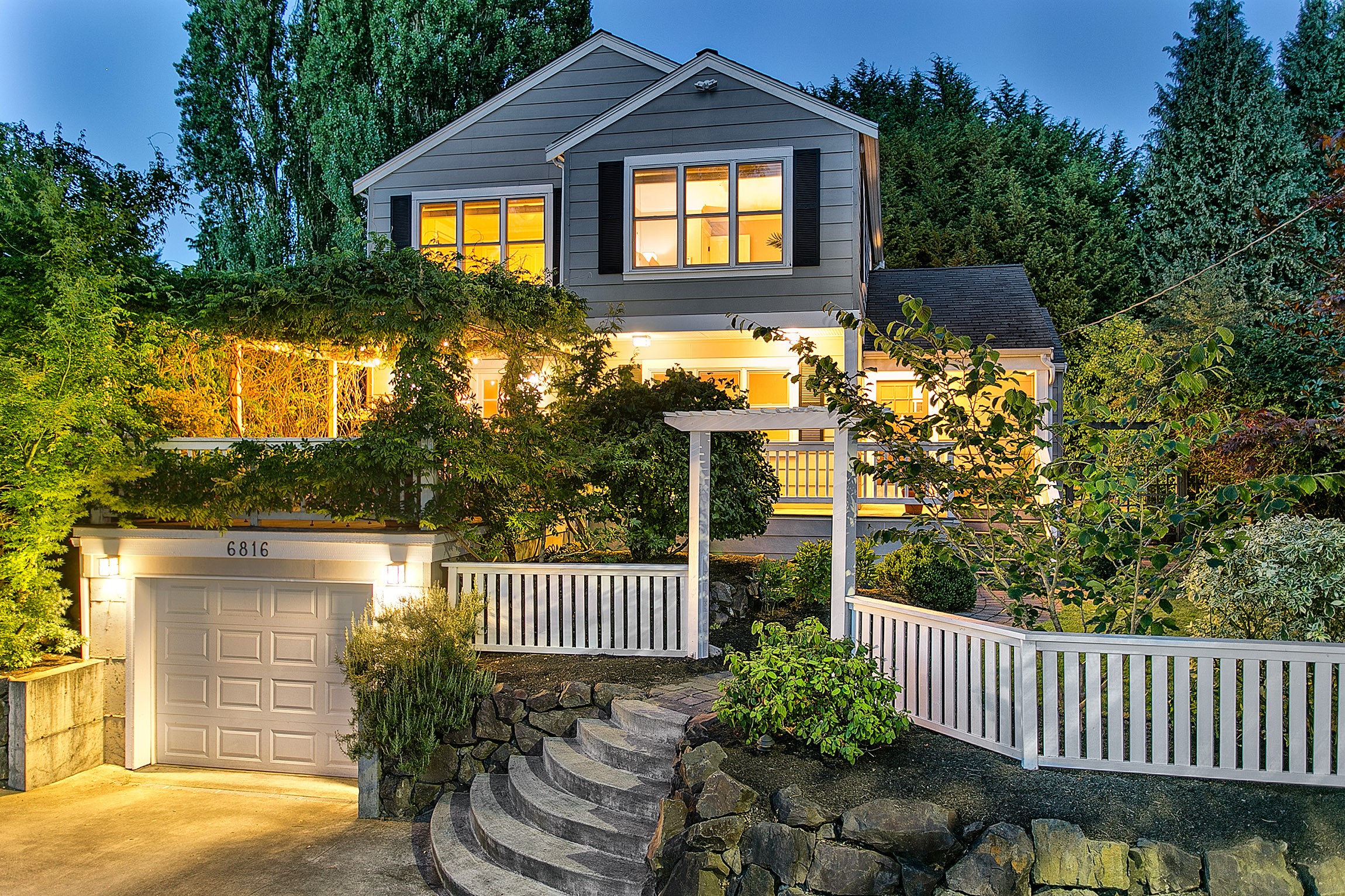 House with garage, stairs, and fence at dusk HD Wallpaper