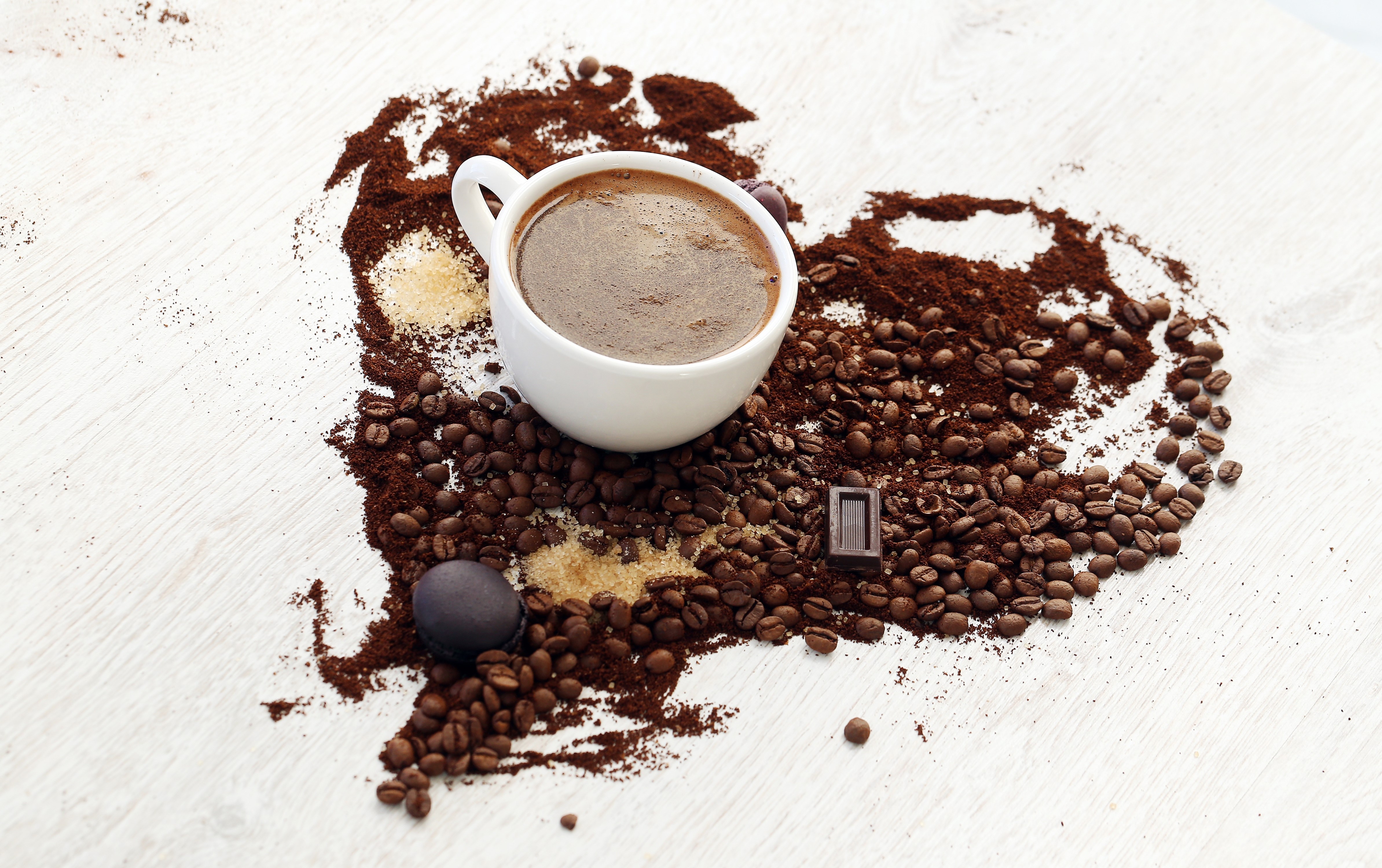 Coffee beans and cup arranged in a heart shape HD Wallpaper