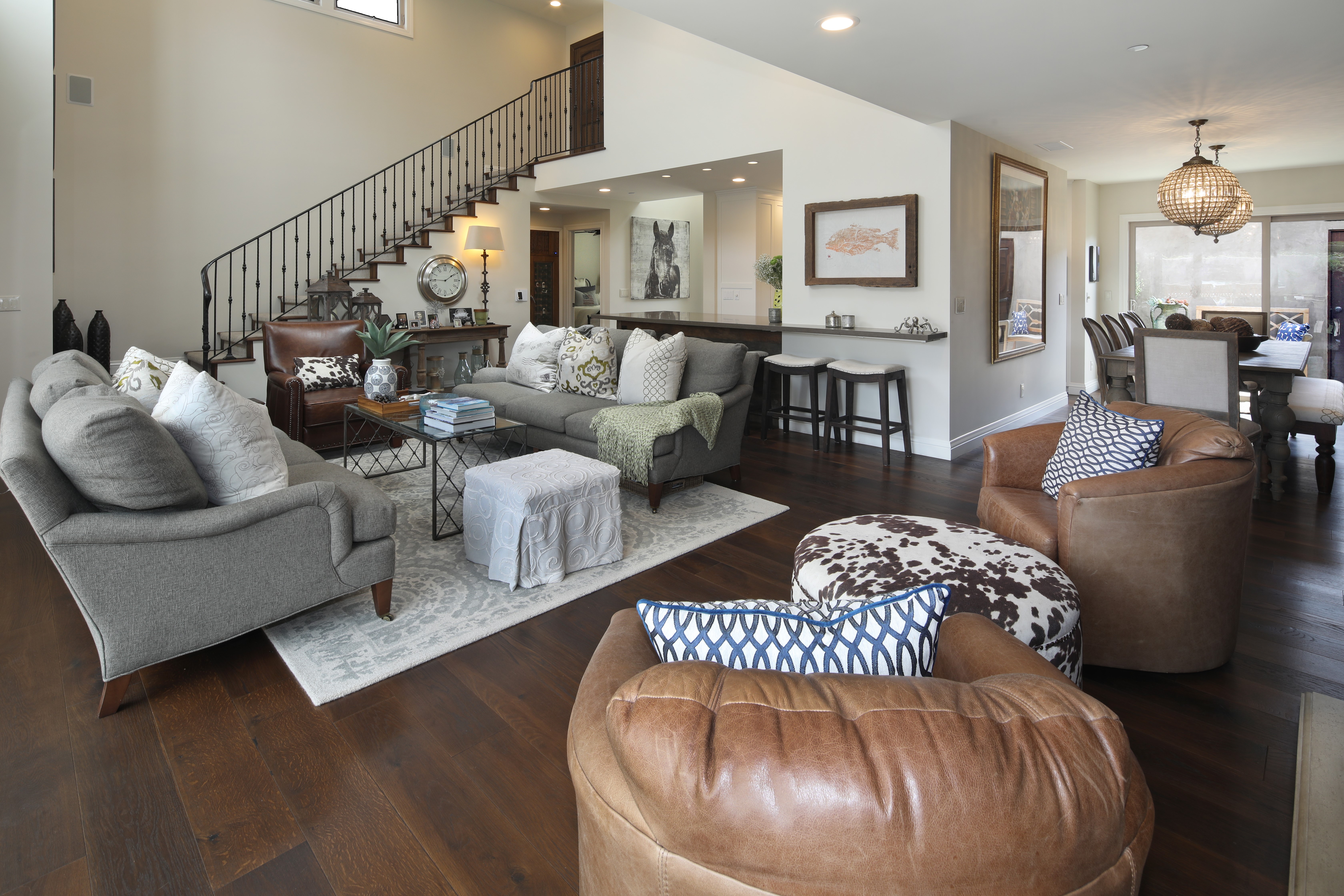 Living room with sofa, armchair, and dining area HD Wallpaper