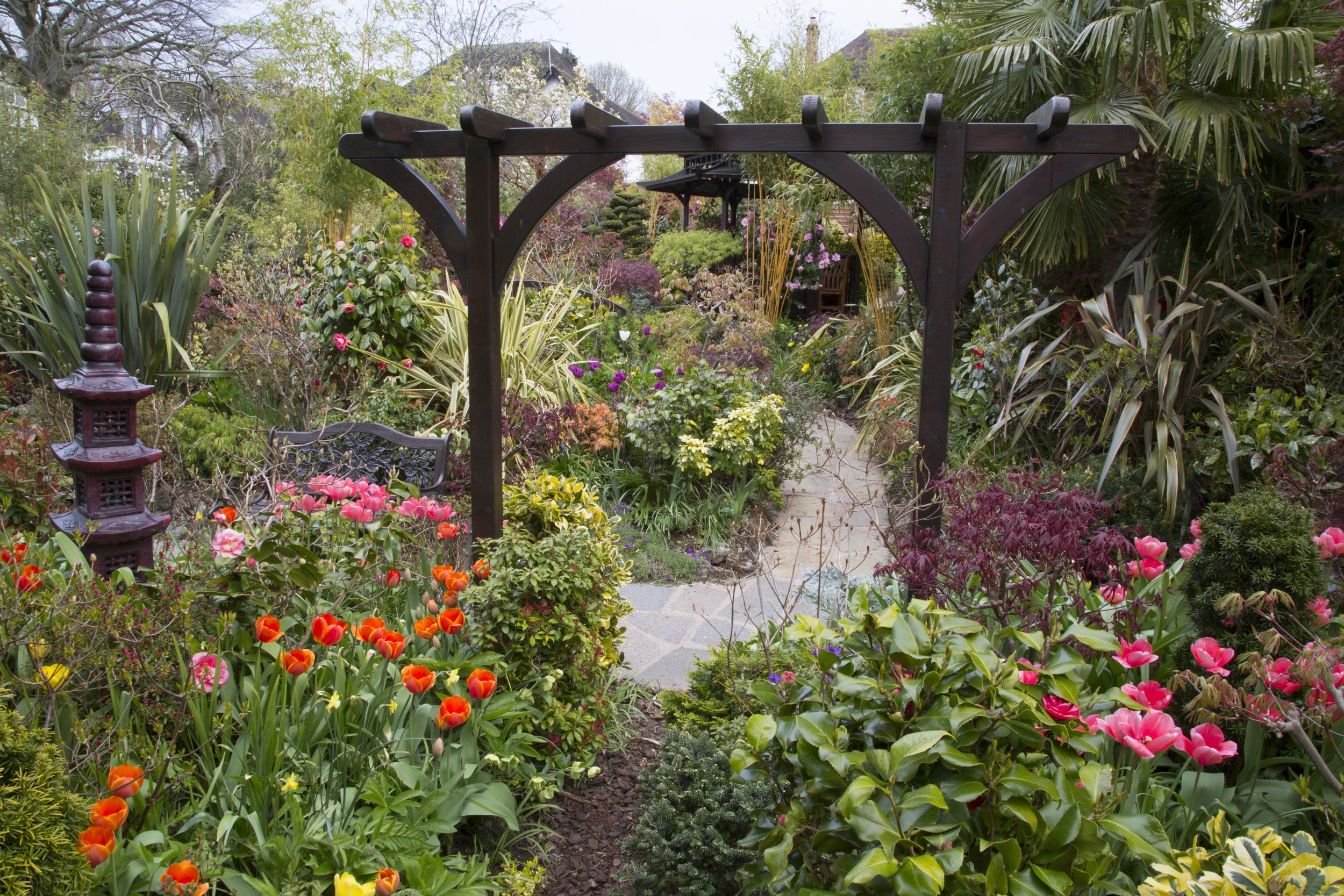 English garden with tulips and pagoda HD Wallpaper