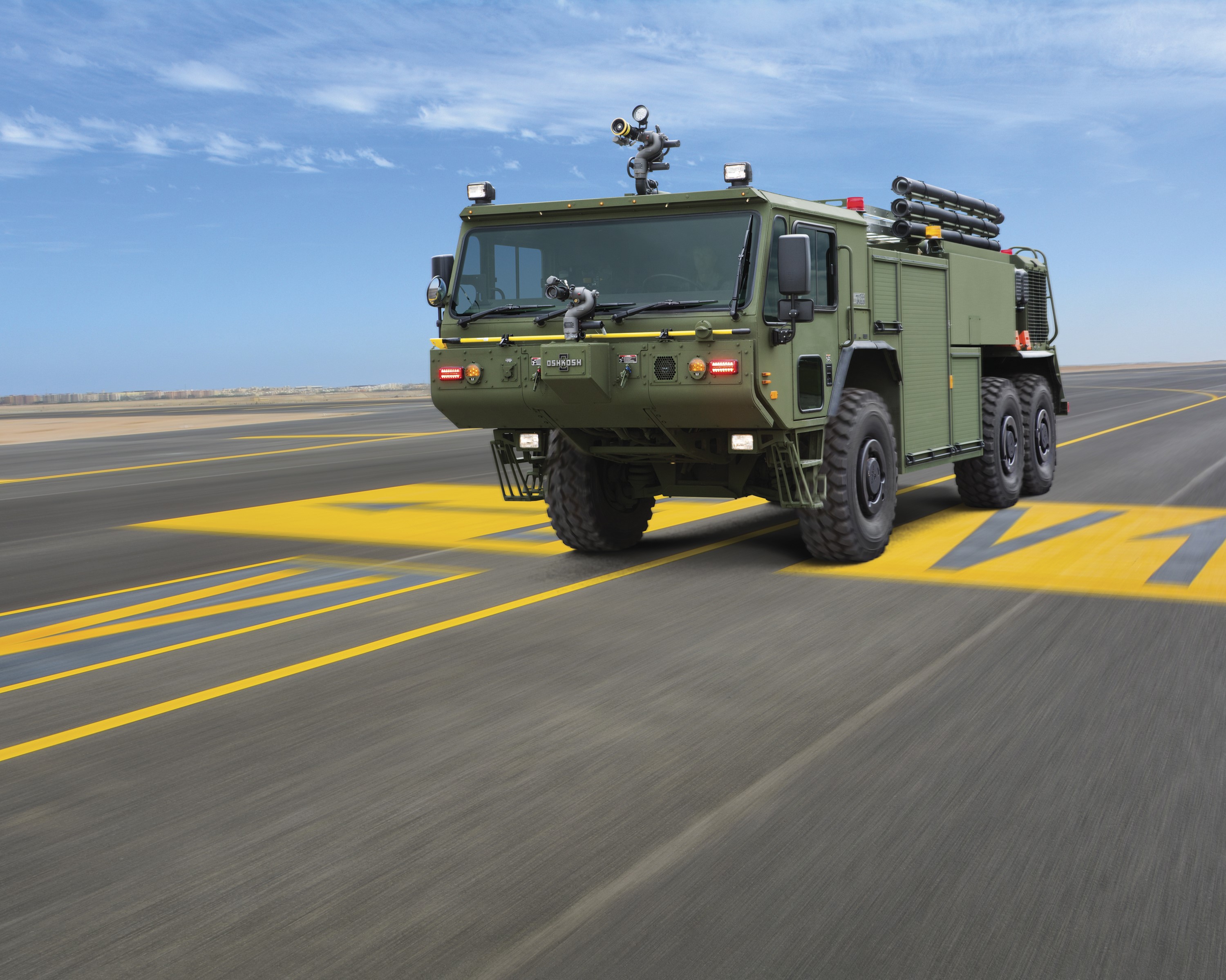 Oshkosh P19R fire engine on airport runway HD Wallpaper