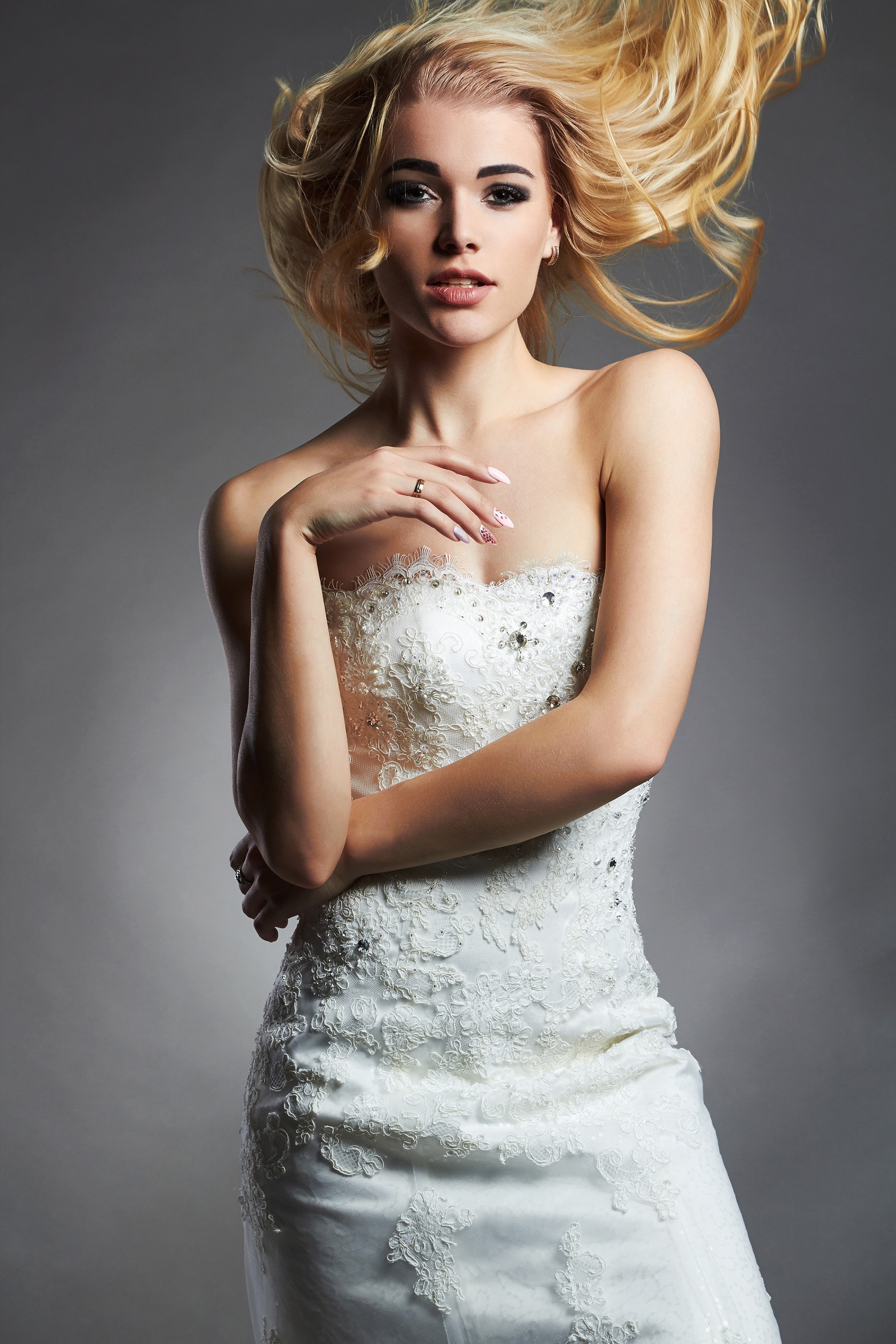 Blonde bride in a white dress with windblown hair HD Phone Wallpaper