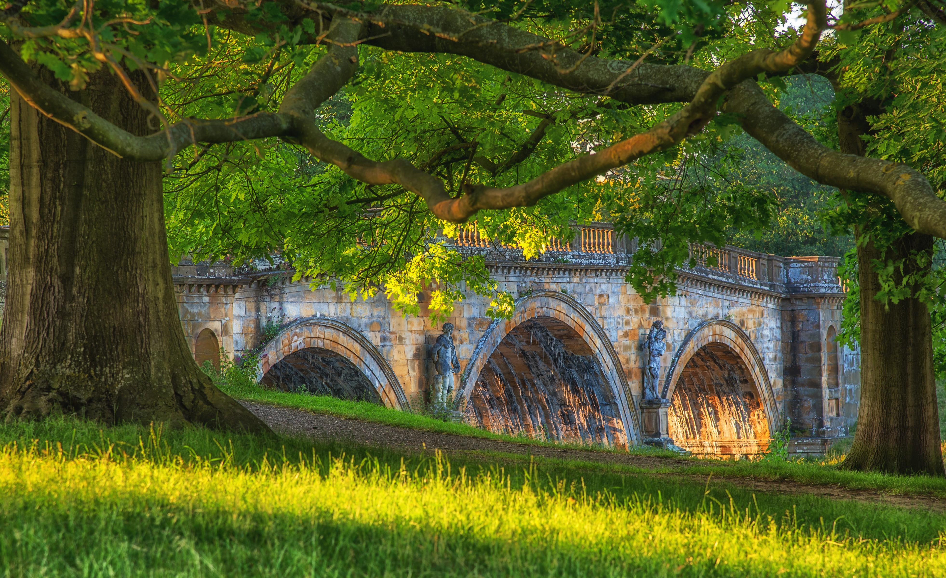 Stone bridge with sculptures at Chatsworth, UK HD Wallpaper