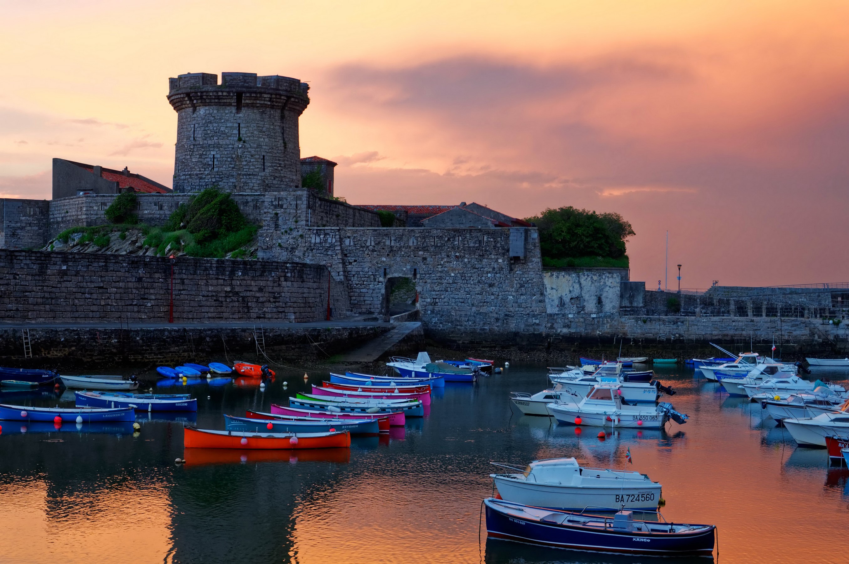 Fort de Socoa fortress with boats at sunset HD Wallpaper