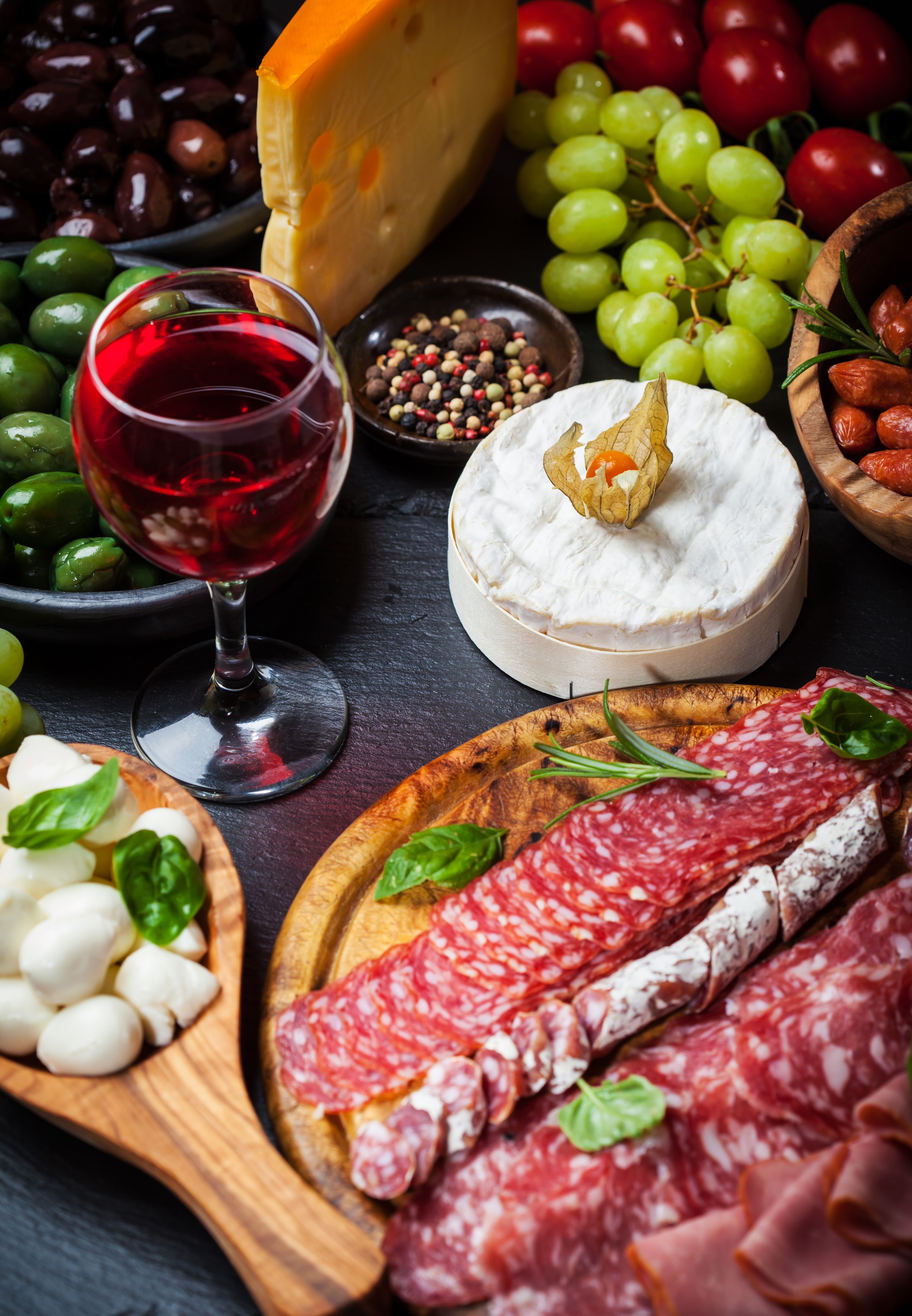 Charcuterie board with wine, cheese, olives, and salami HD Phone Wallpaper