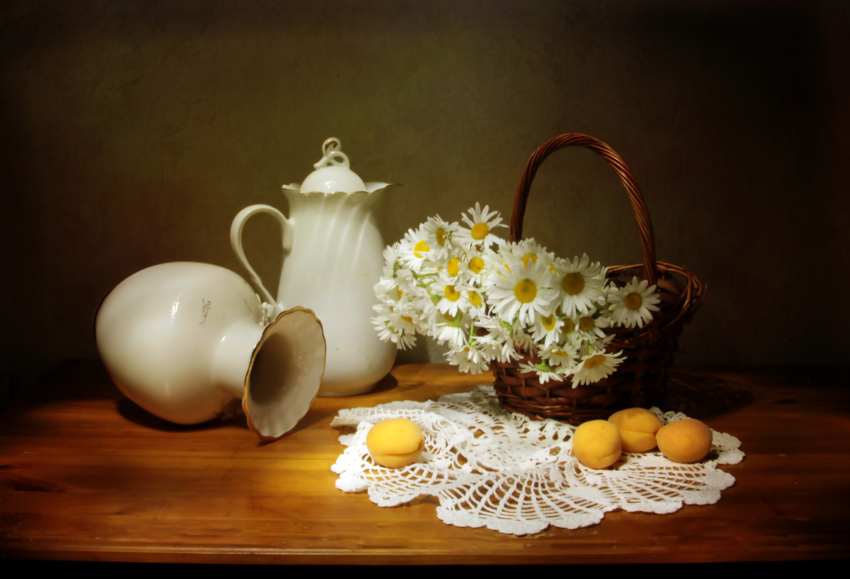 Still life with camomiles, apricots, and white vases on a wooden table HD Wallpaper
