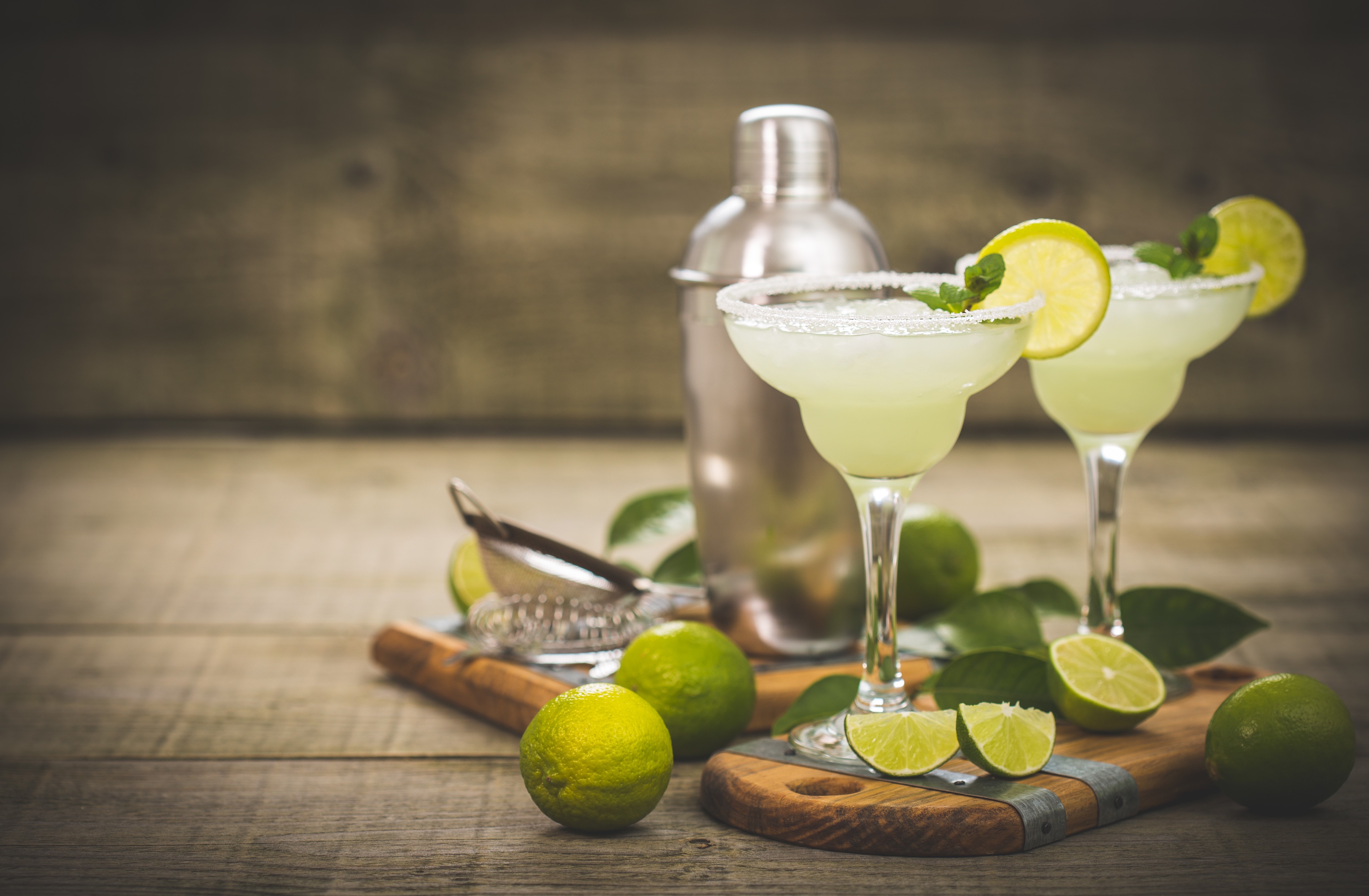 Two margaritas with limes and shaker HD Wallpaper