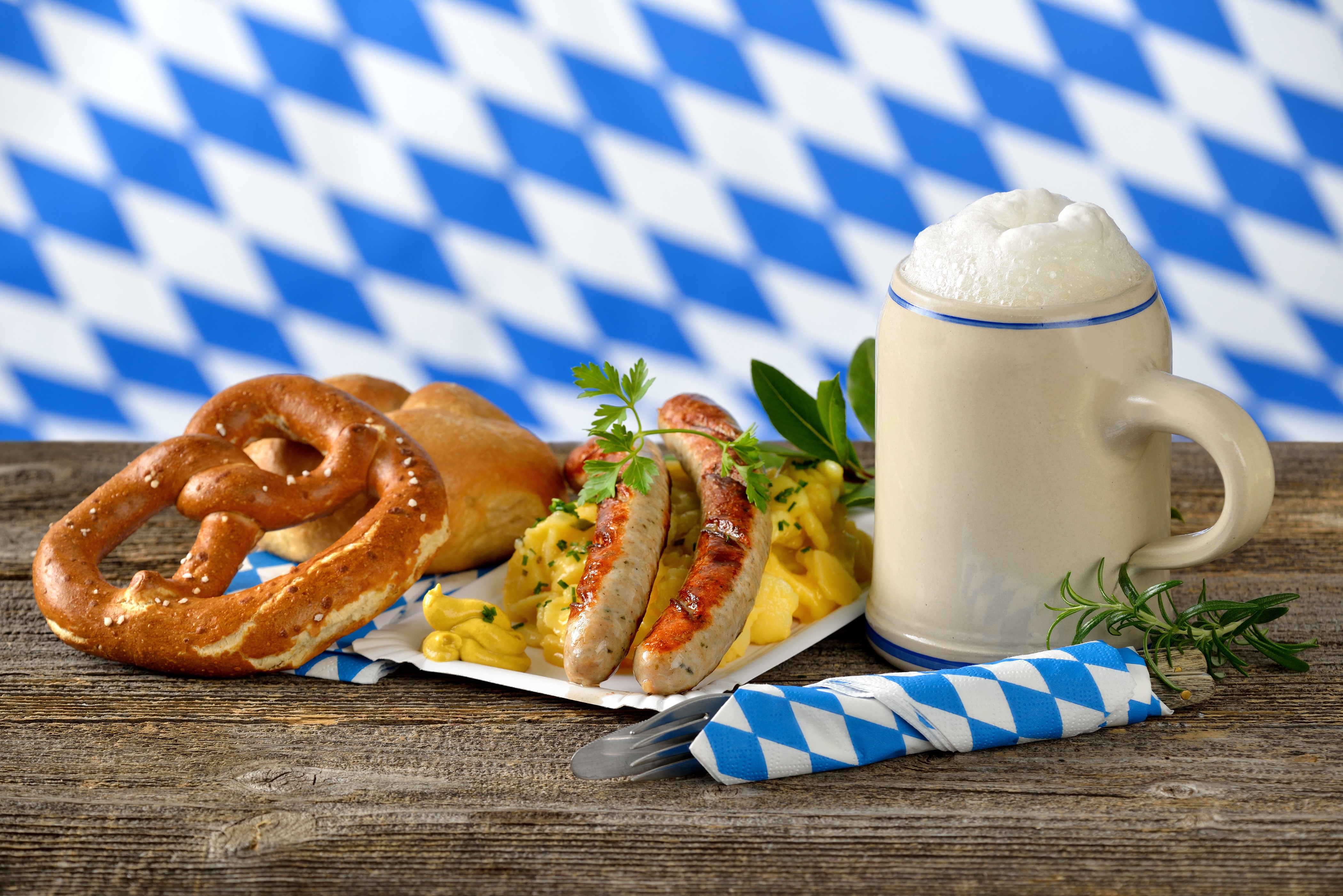 Sausages, Pretzel, and Beer Mug with Bavarian Background HD Wallpaper