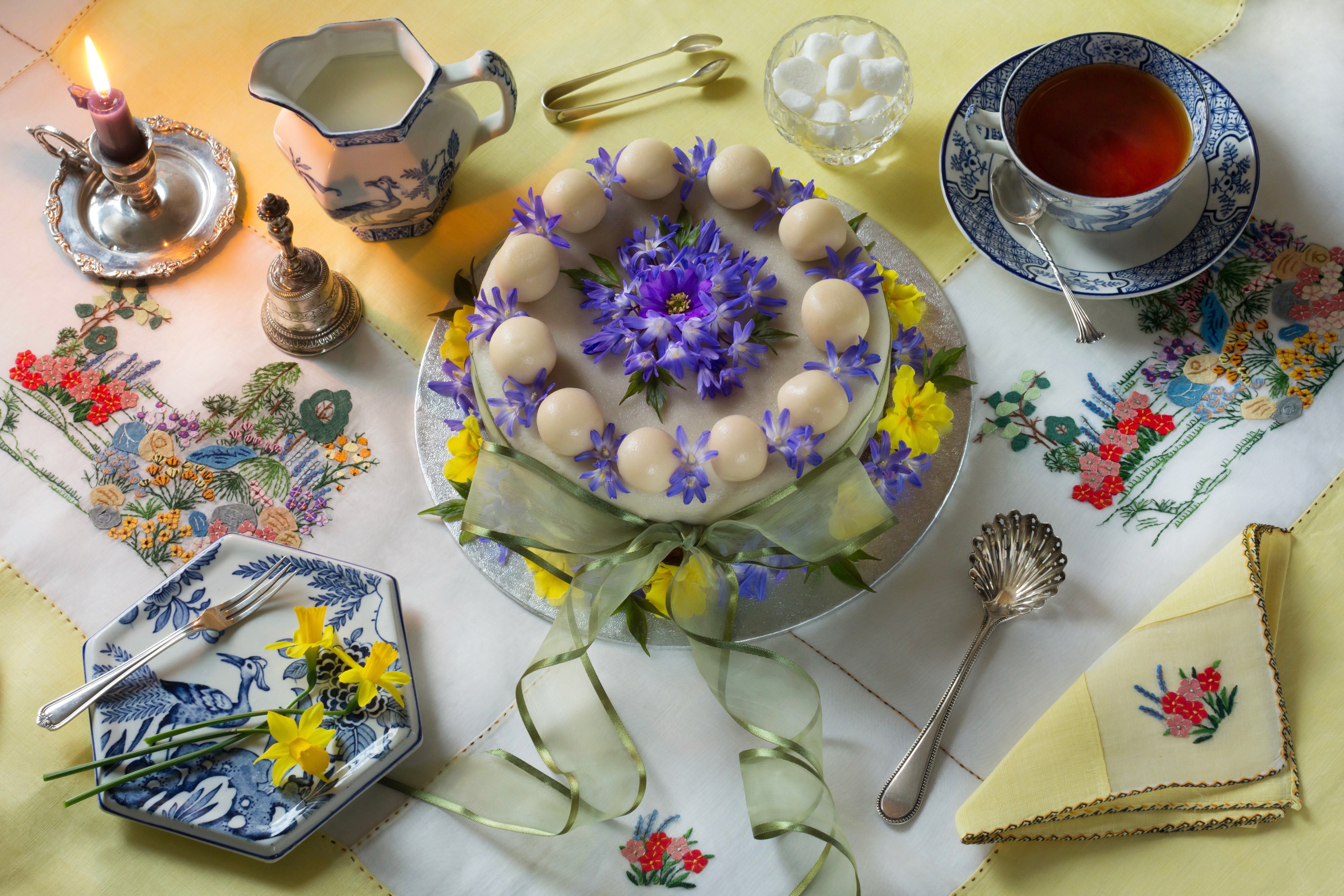 Still-life of a cake with tea and daffodils HD Wallpaper