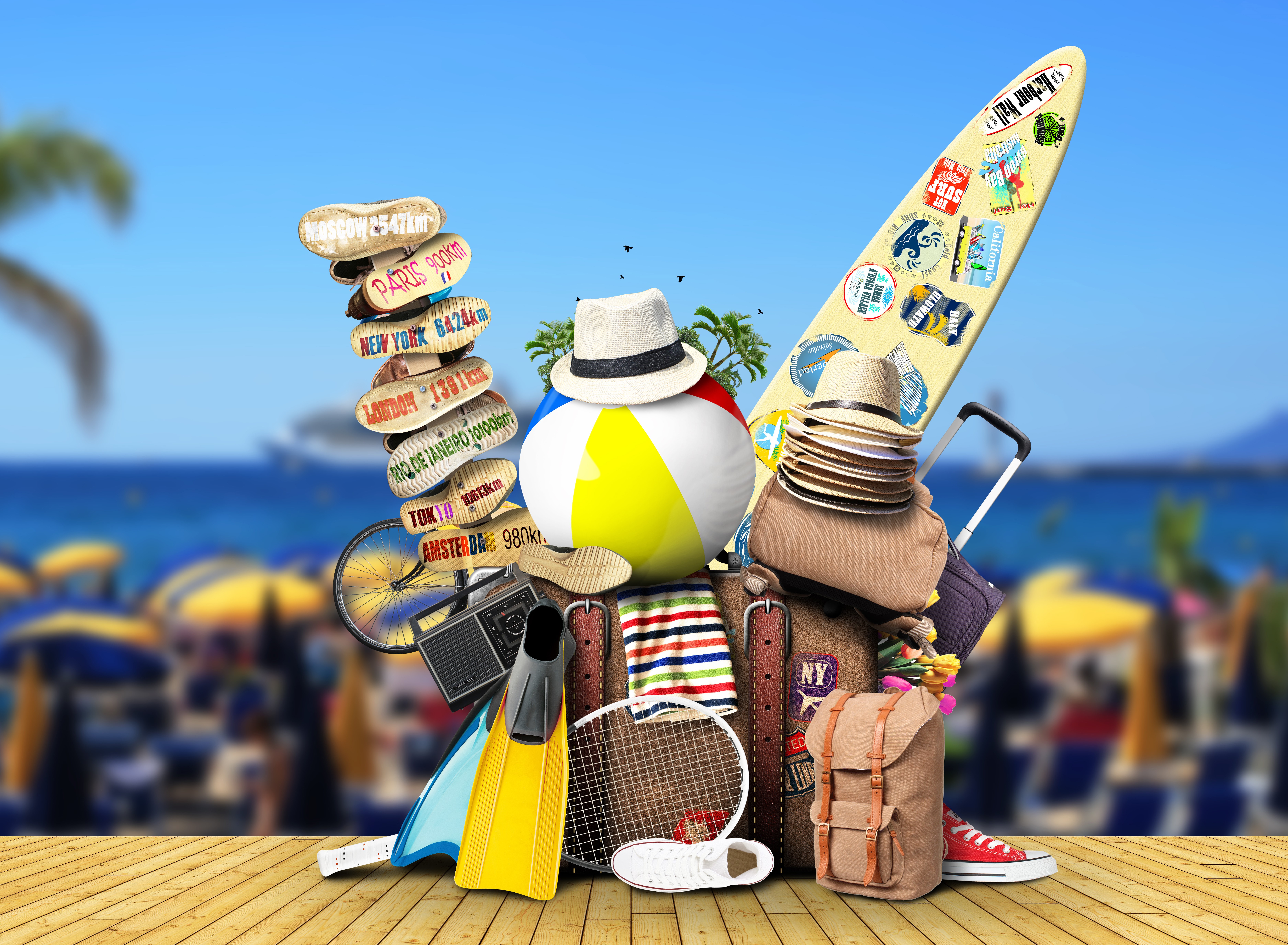 Travel items on a beach background HD Wallpaper