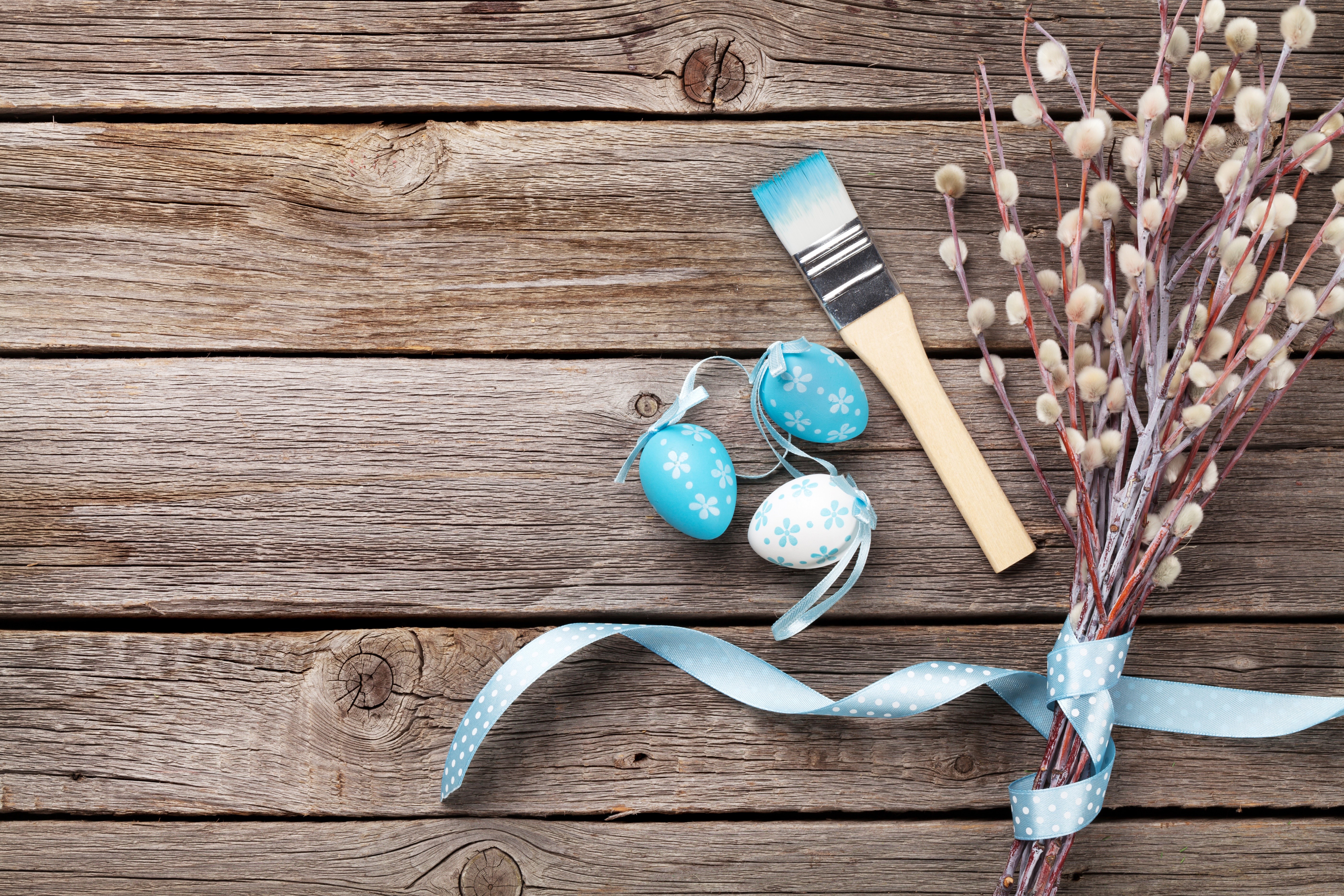 Easter eggs and paintbrush on wood planks HD Wallpaper