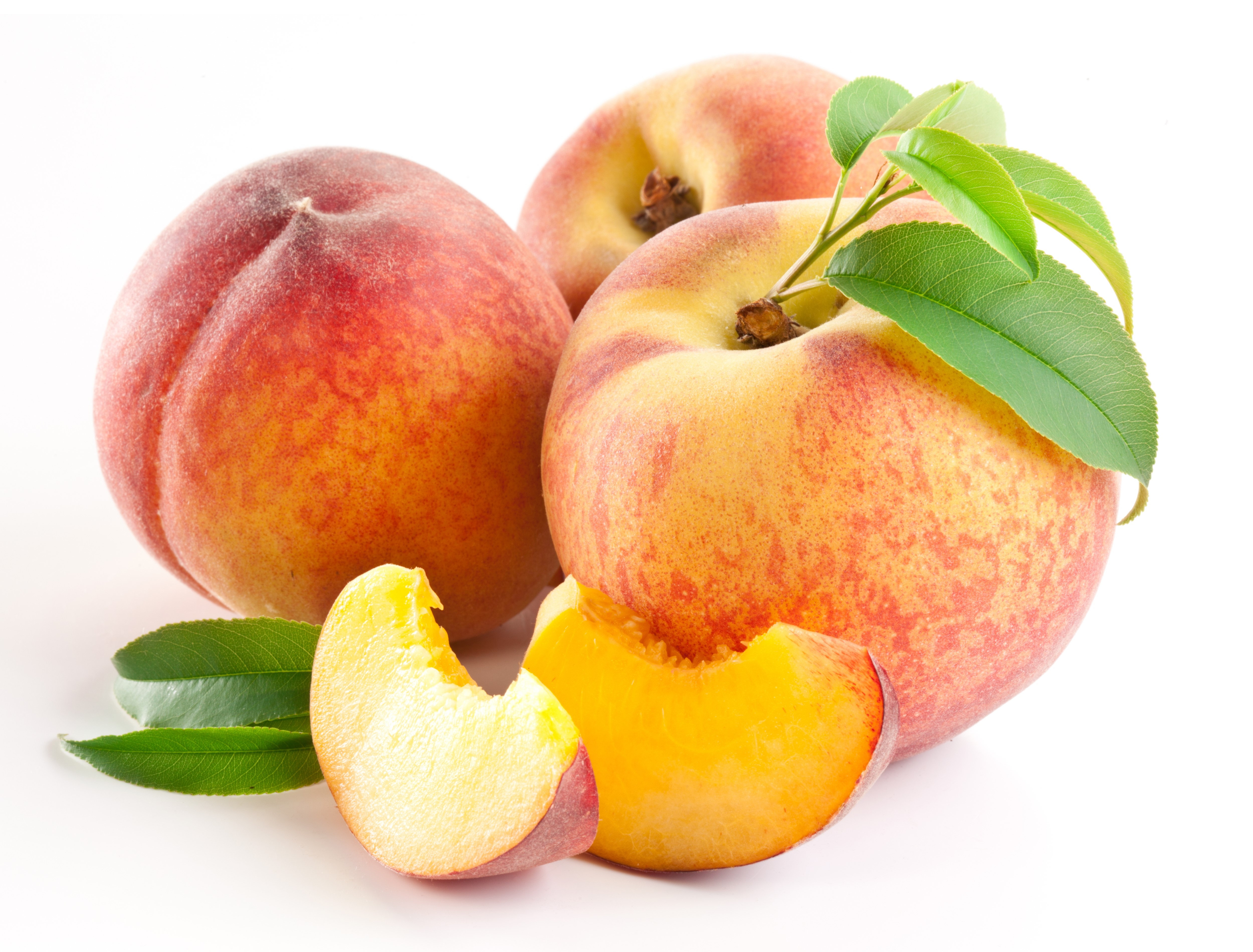 Peaches with leaves and slices on white background HD Wallpaper