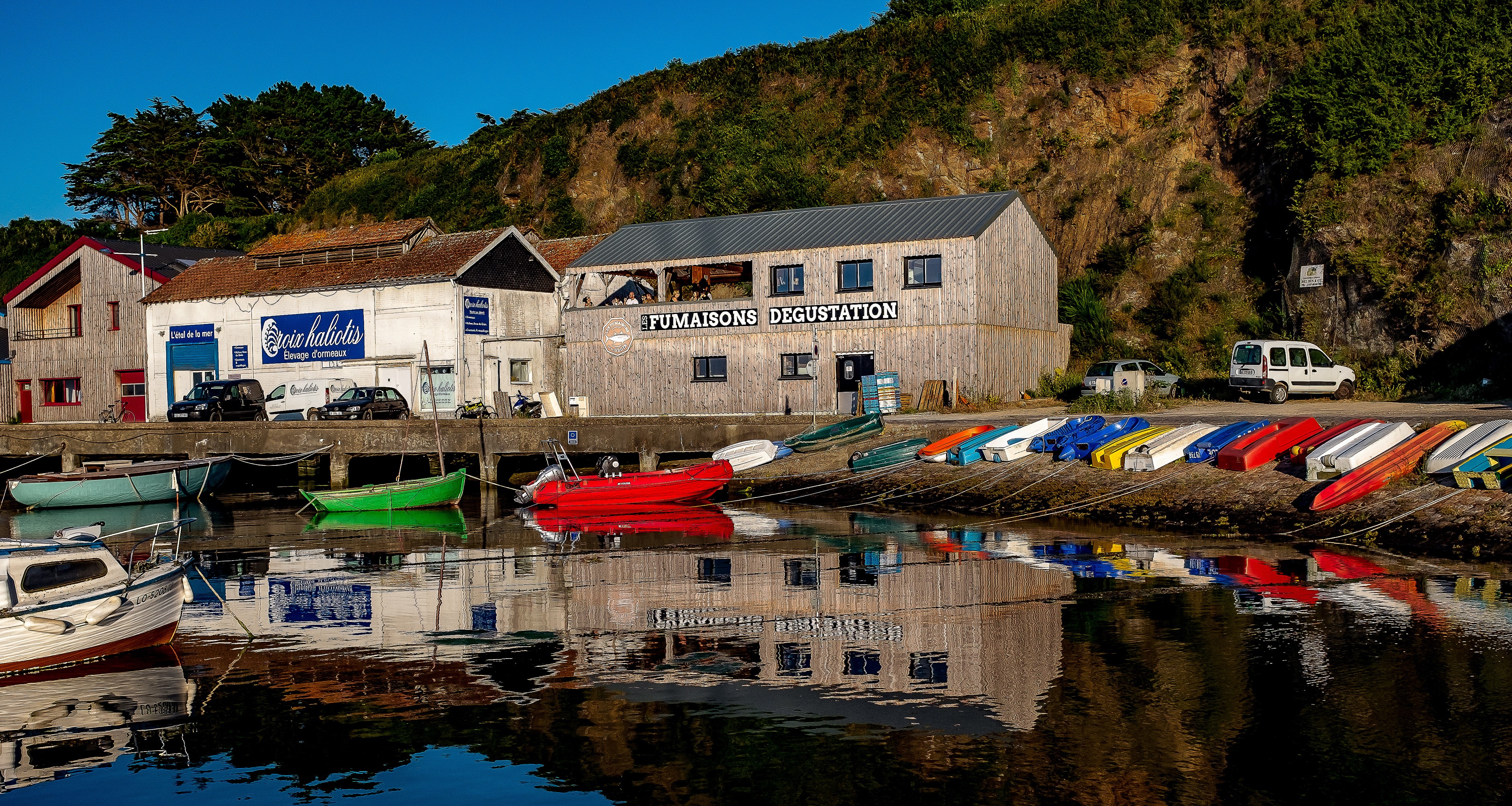 Boats docked in a harbor in Groix, Brittany, France HD Wallpaper