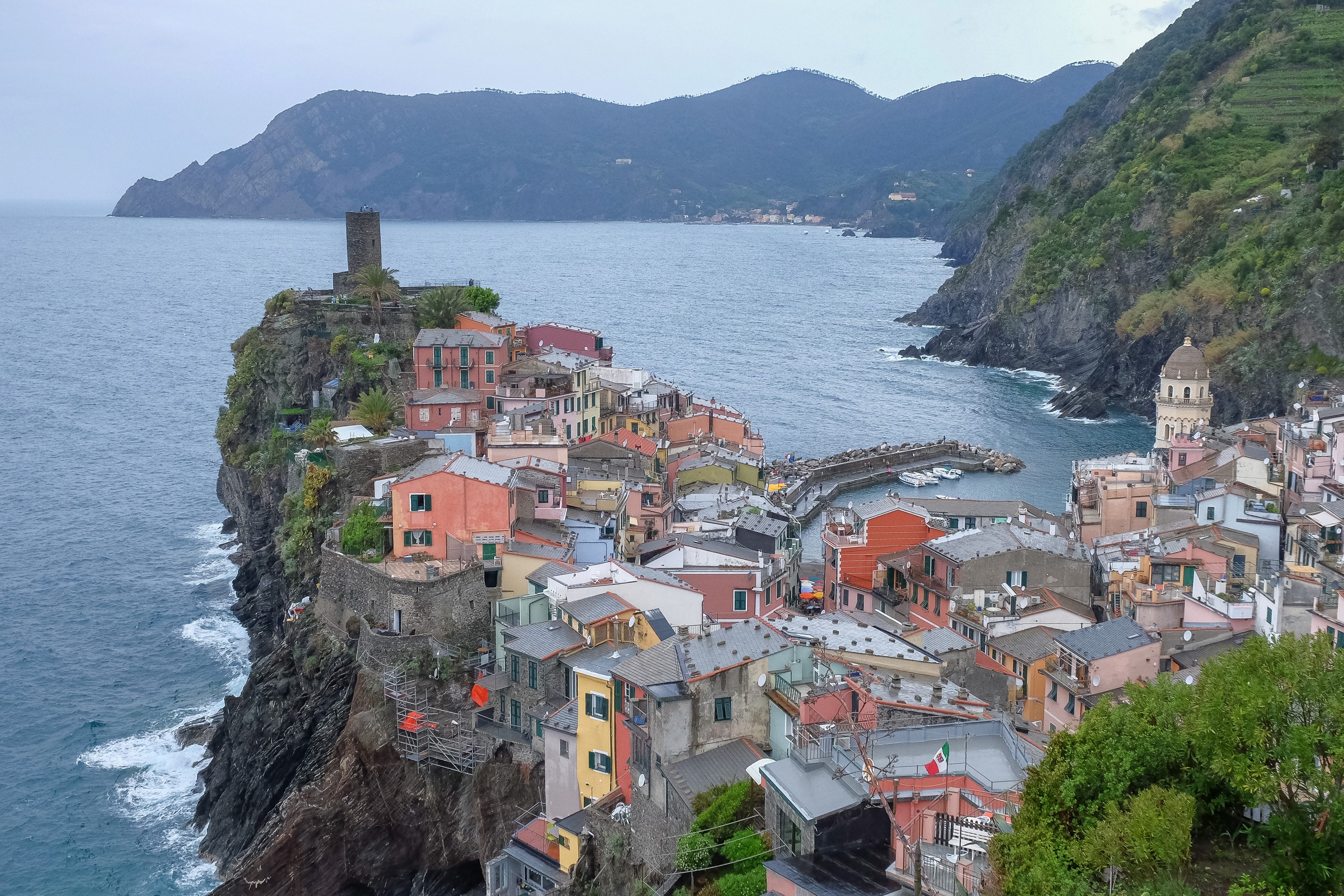 Vernazza, Liguria, Italy: Colorful houses on a rocky crag overlooking the bay. HD Wallpaper