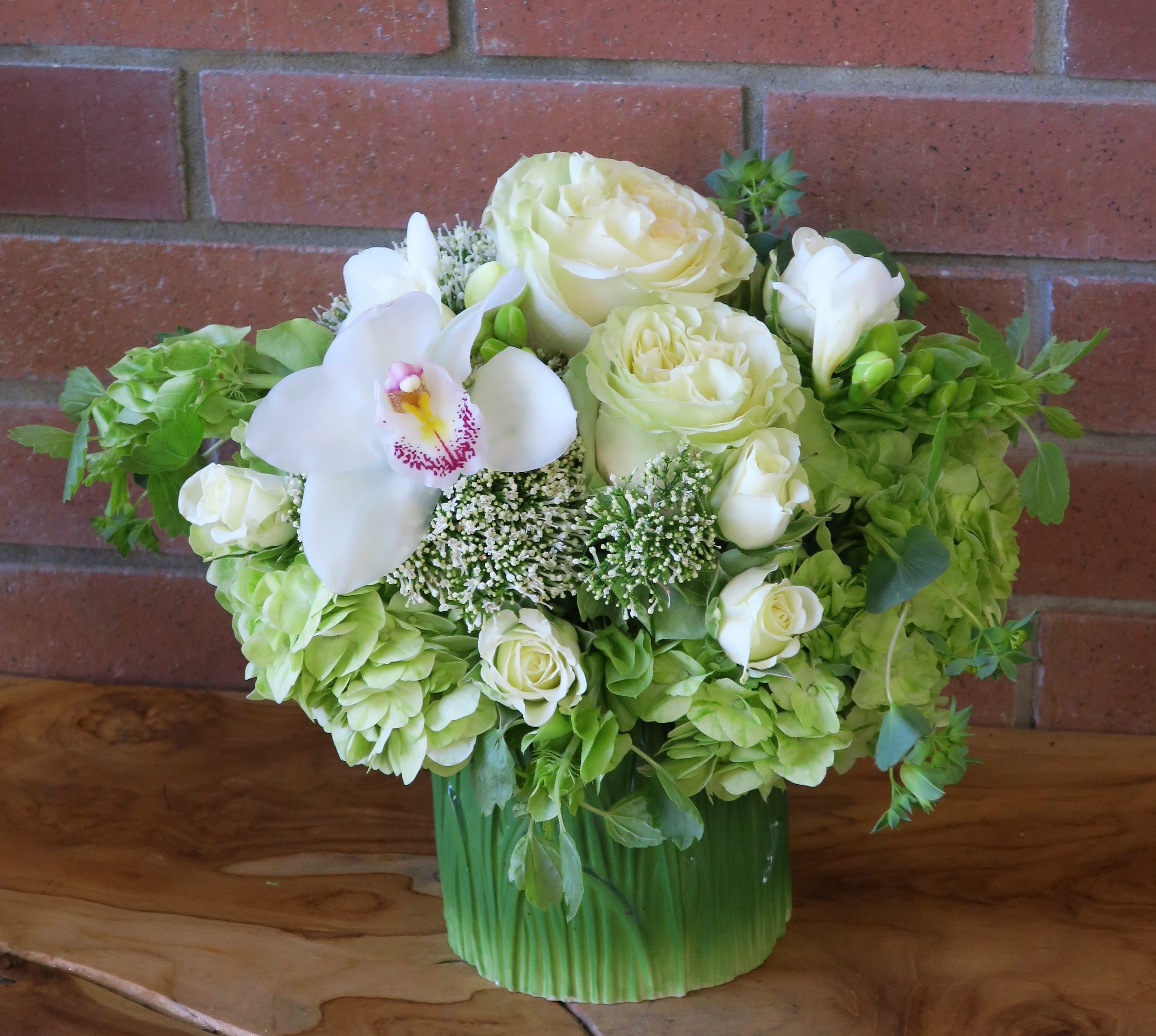 White orchid and roses floral arrangement in green vase HD Wallpaper