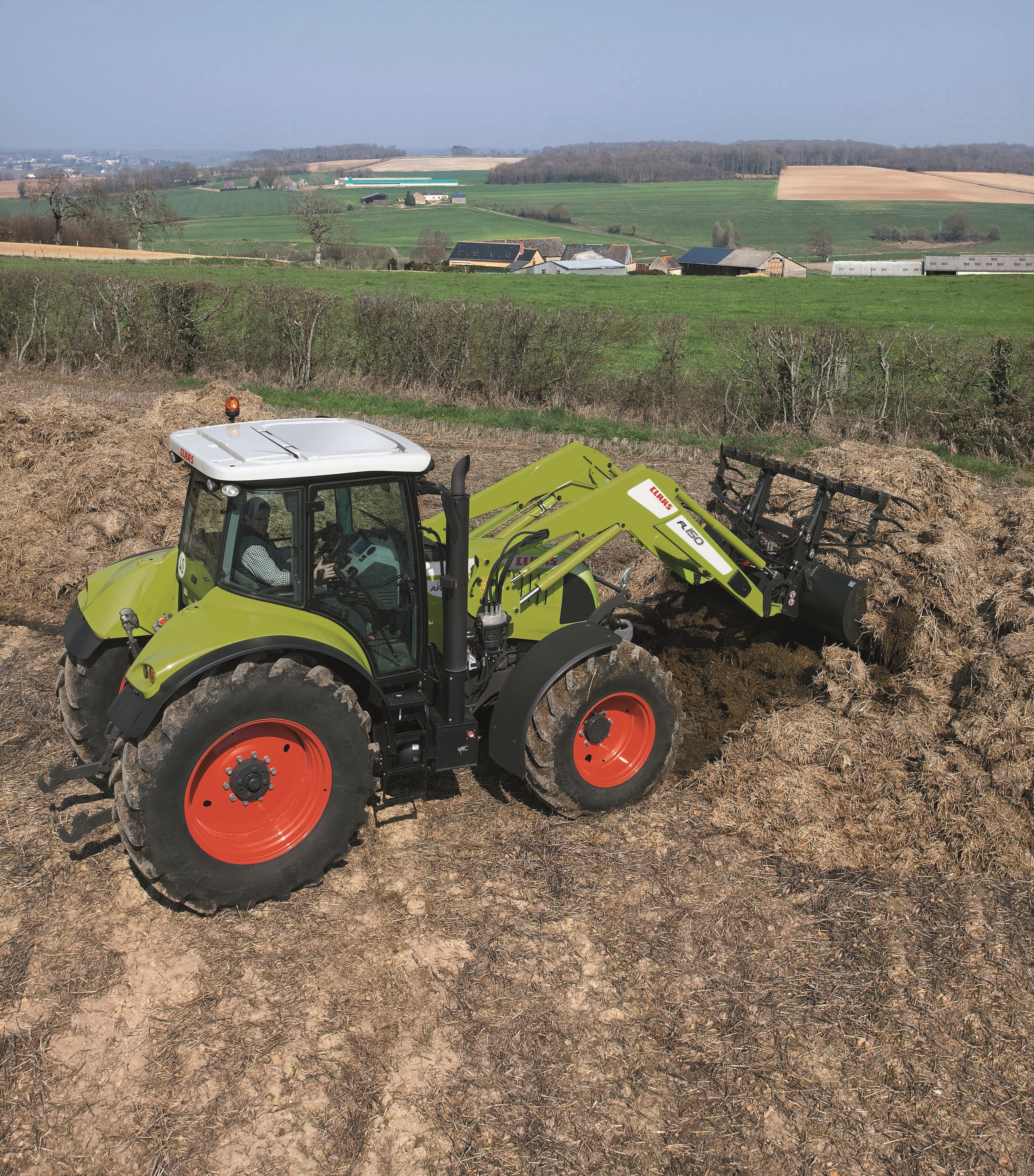 Claas Arion 600 tractor loading manure HD Wallpaper