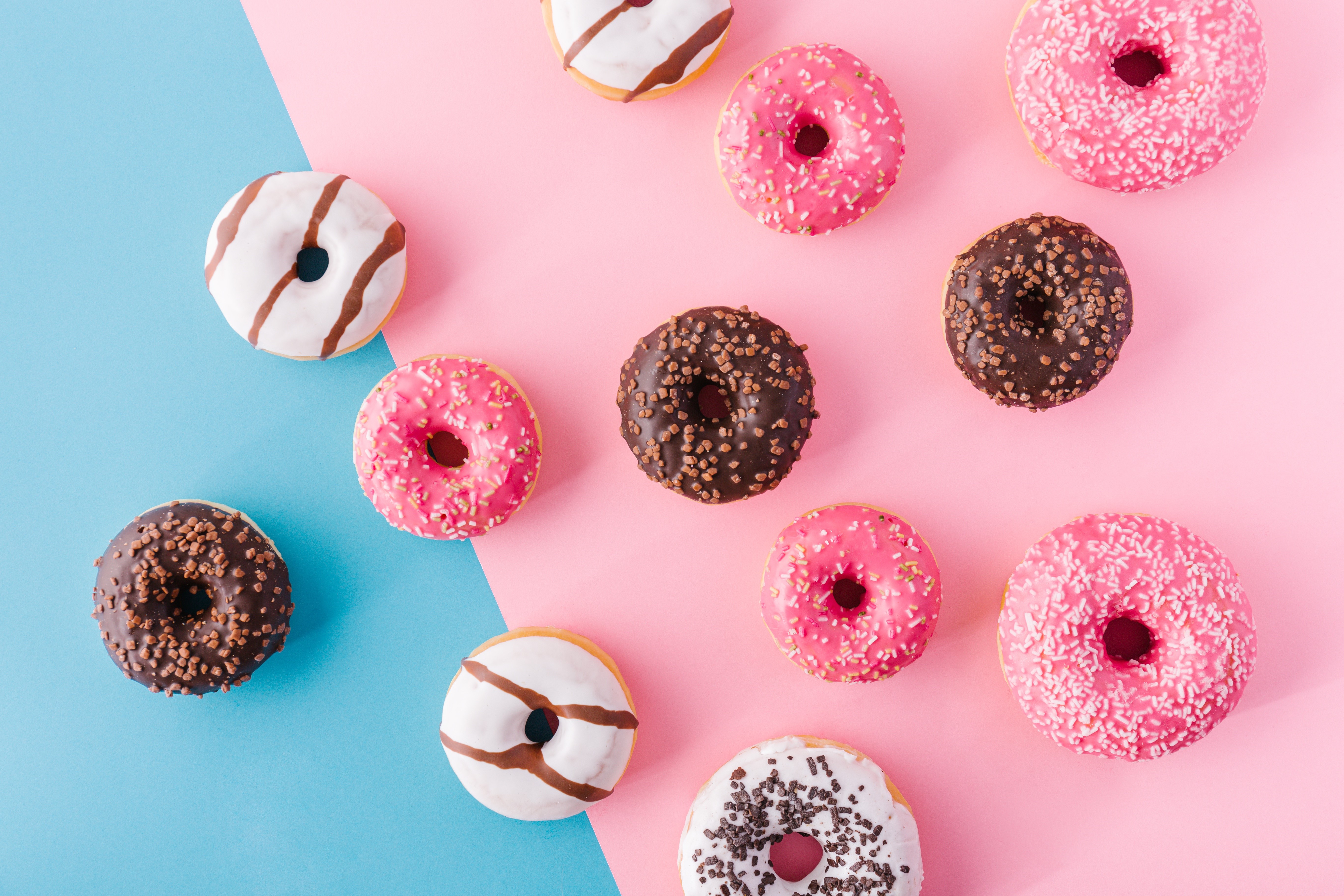 Donuts on a pink and blue background HD Wallpaper